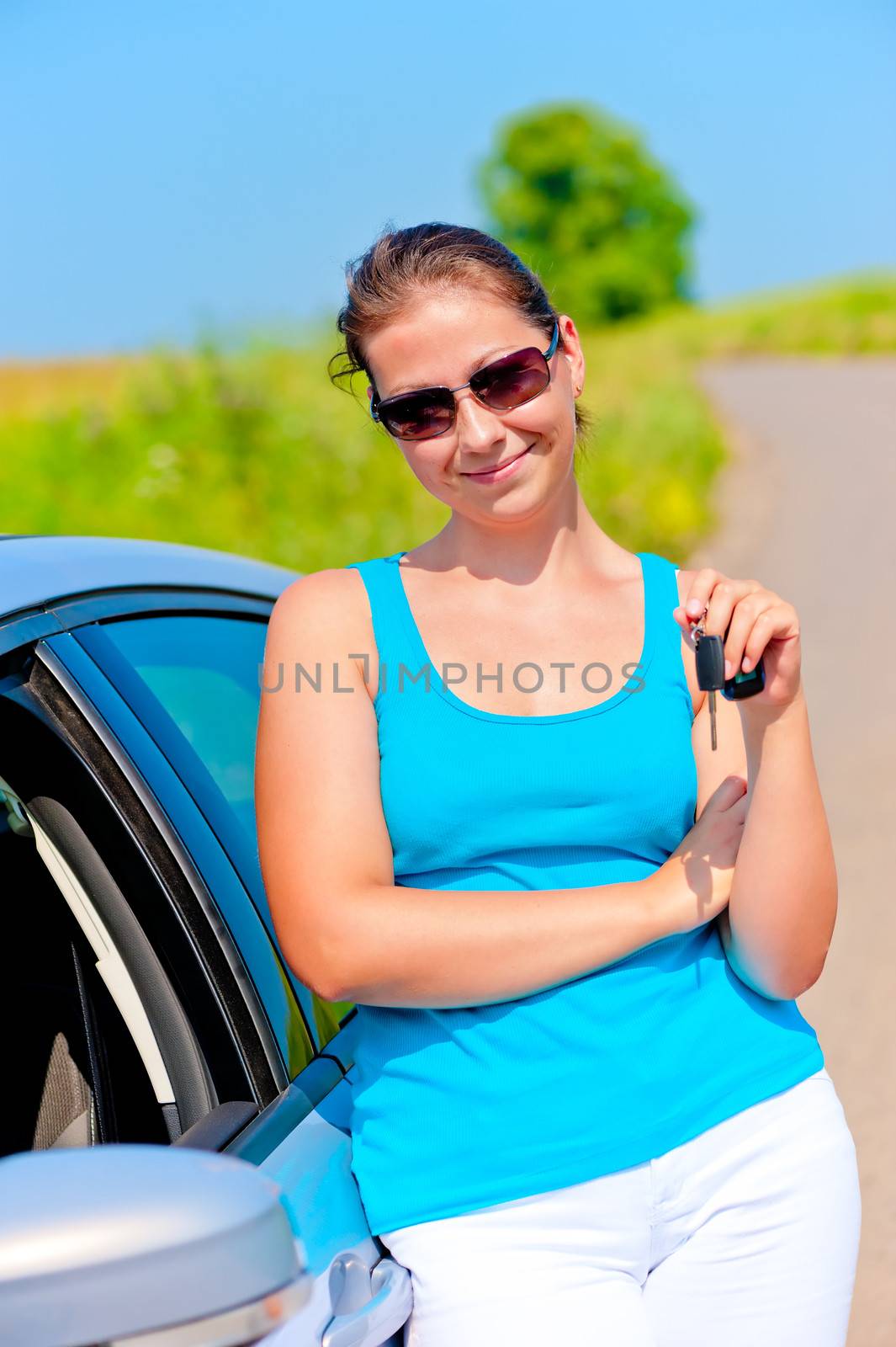 woman with the keys to her new car