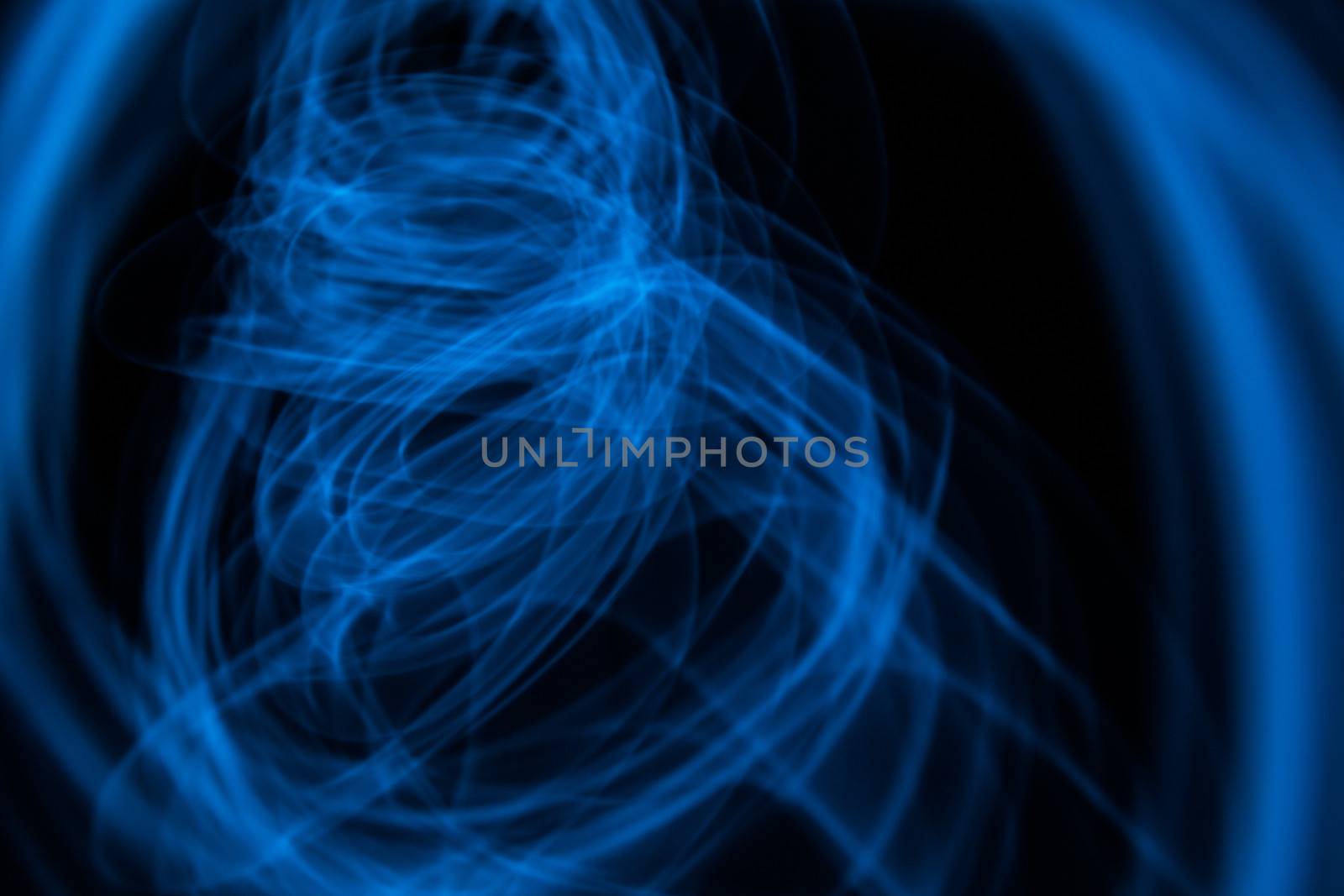 Curved bluish lines. Abstract forms of light in long exposure.