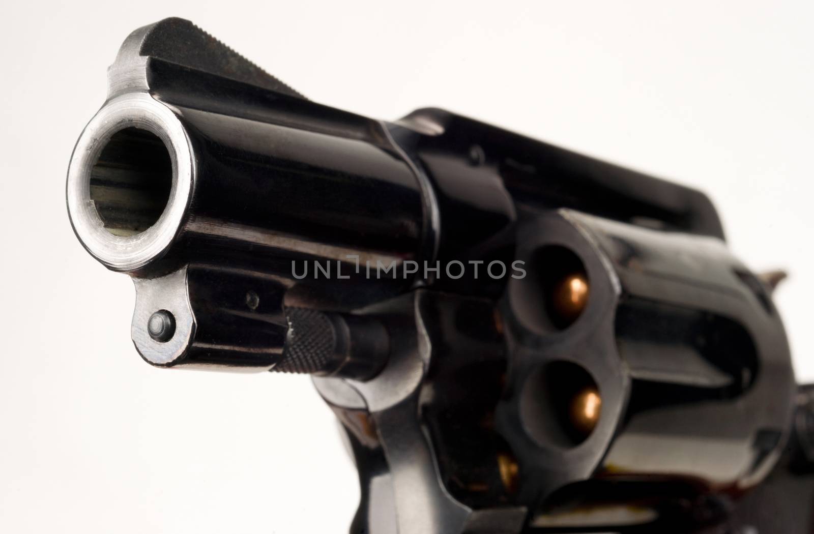 38 Caliber Revolver Pistol Loaded Cylinder Gun Barrel Close Up Pointed on White
