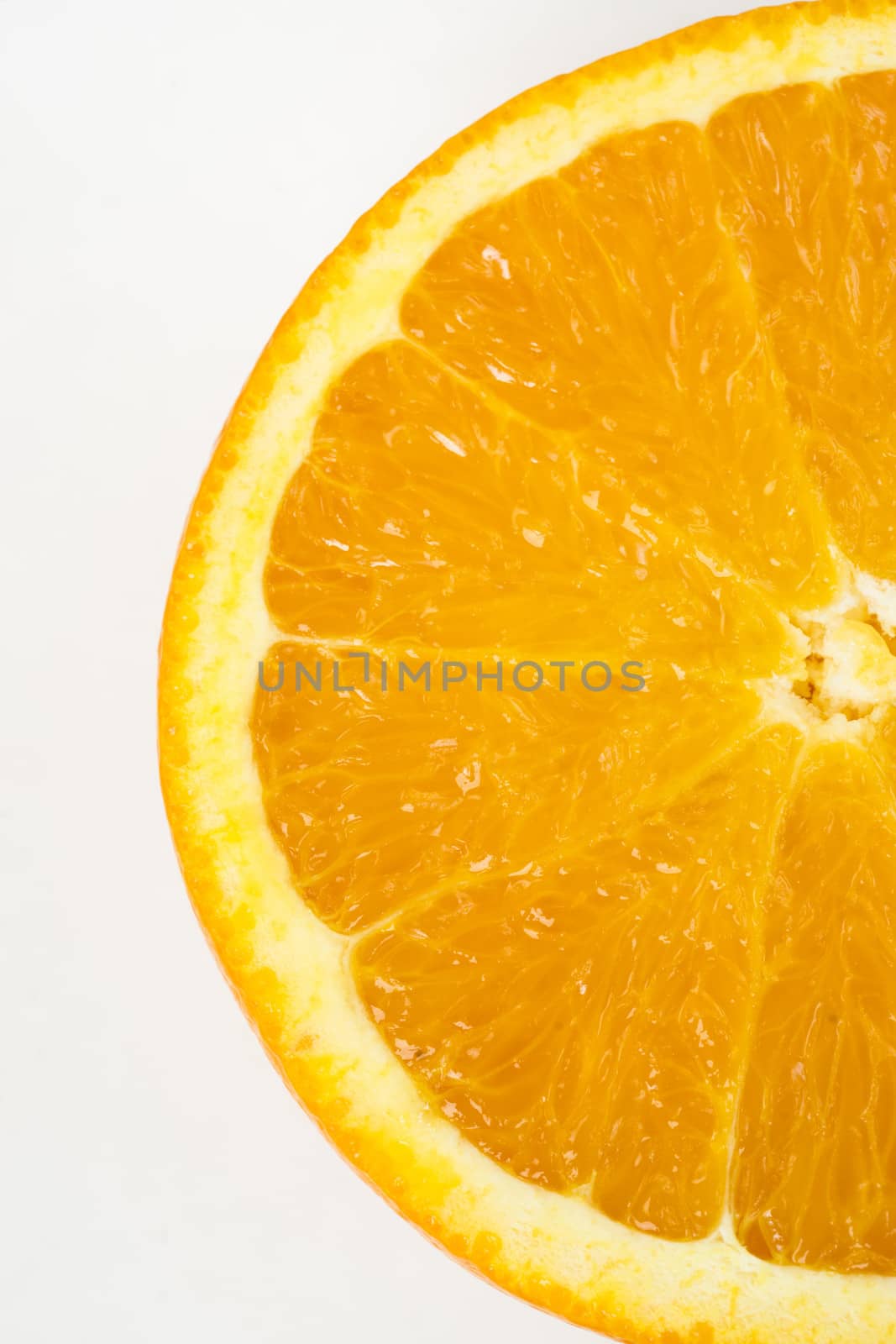 Half a Sliced Raw Food Orange Isolated on White
