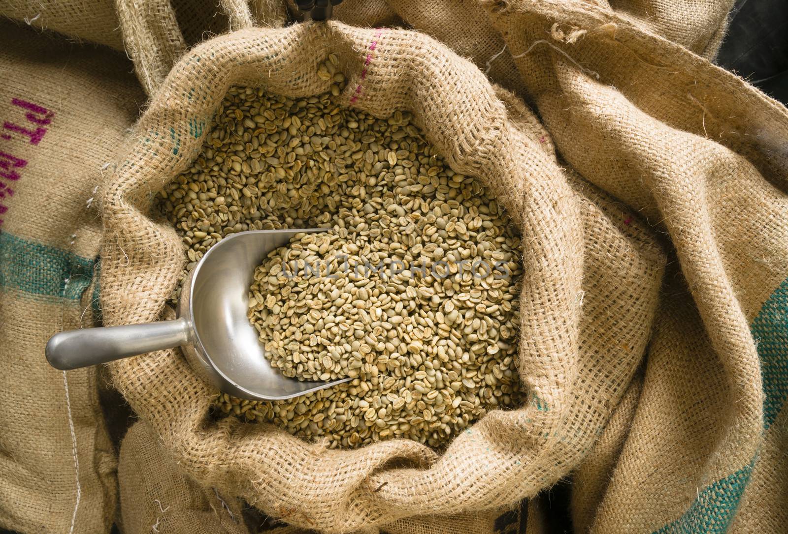 Big sack of coffee beans waiting to be roasted in coffee roaster warehouse