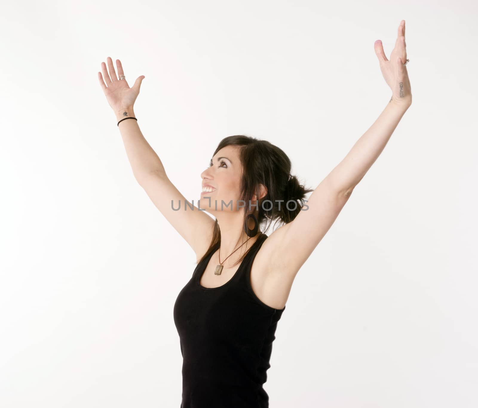 Pretty Brunette Woman Holds Arms Outstretched Jubilant Looking Up by ChrisBoswell