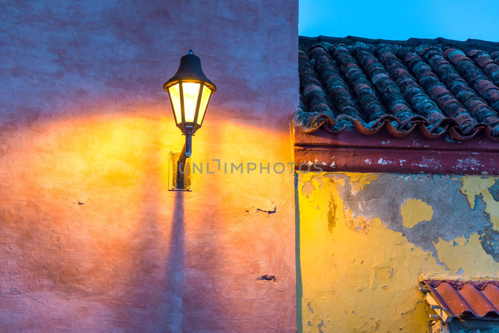 Old colonial buildings and a streetlight at night in the old town of Cartagena, Colombia