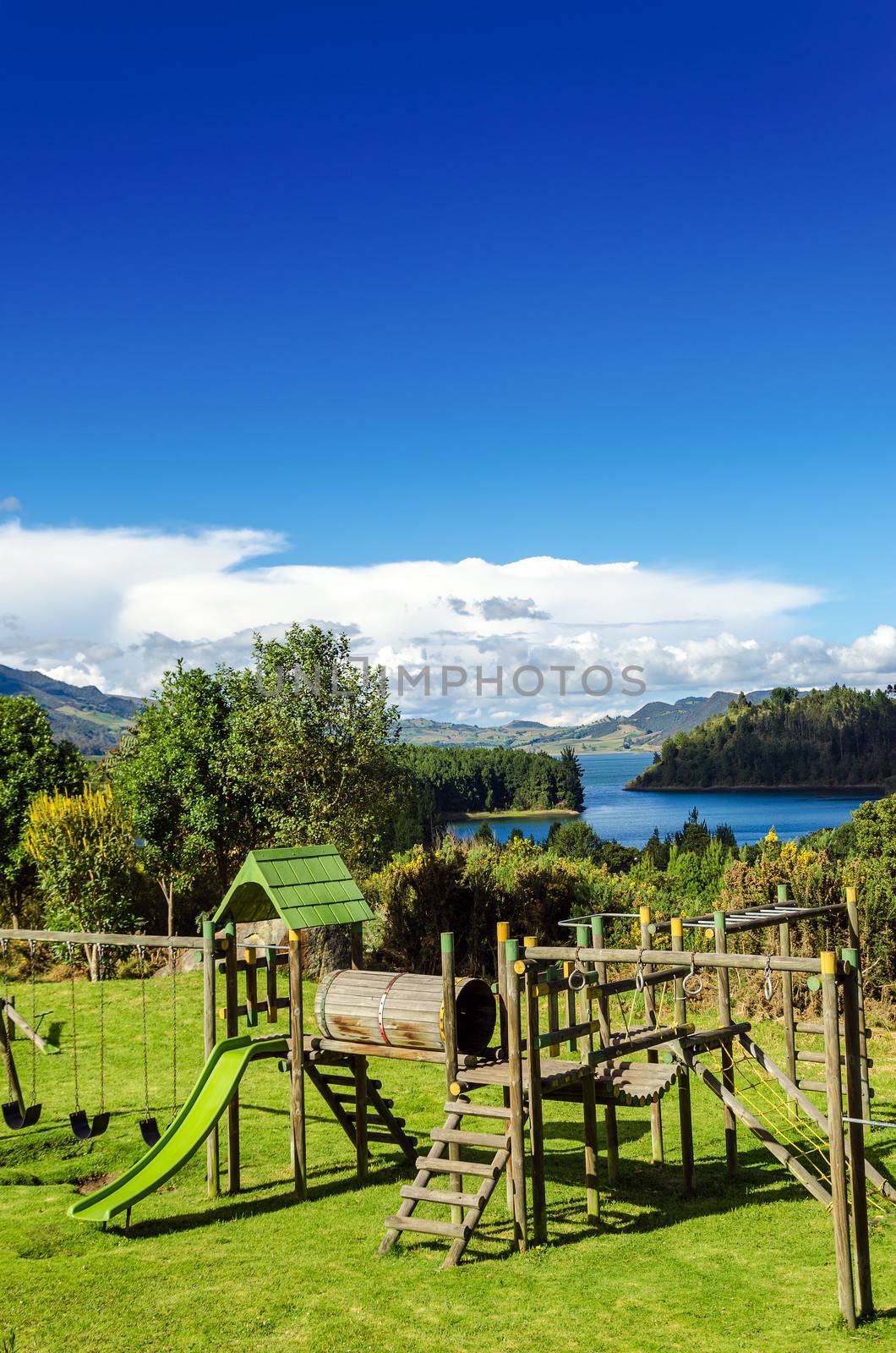 Vertical view of a playground in a natural setting with Neusa lake in the background in Cundinamarca, Colombia