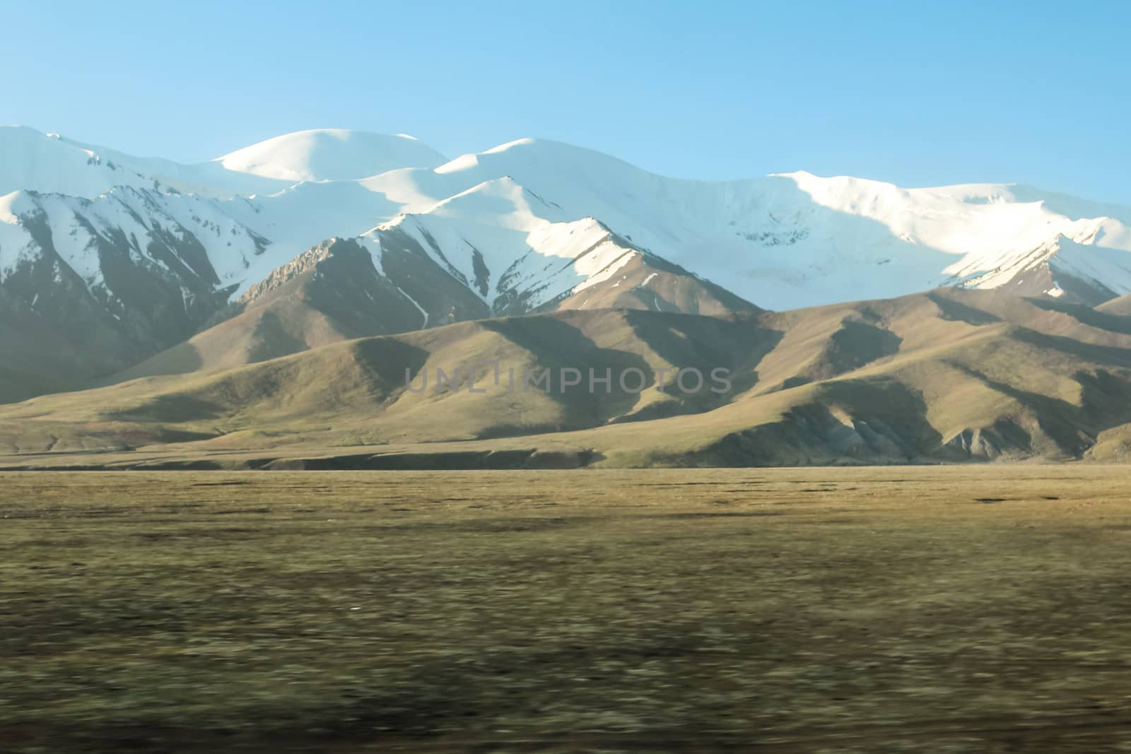 Snow mountains with clouds by IVYPHOTOS