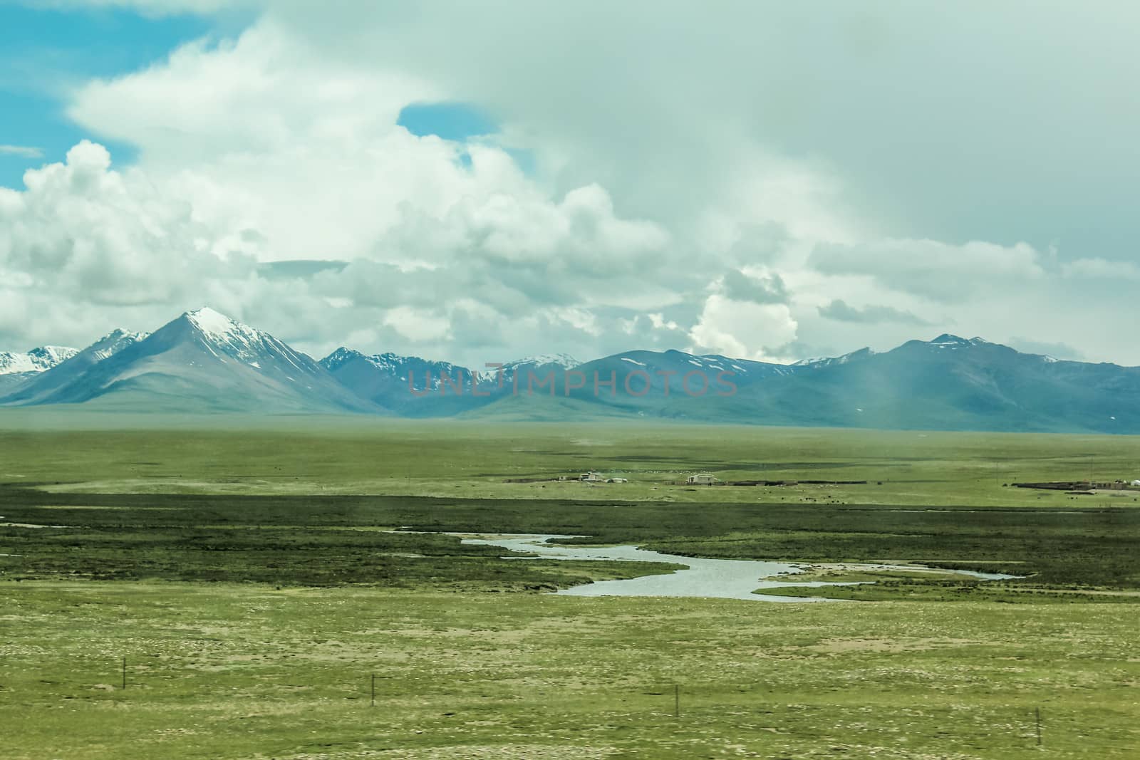 Scenic landscape view of snow mountain ranges and surroundings in Tibet 