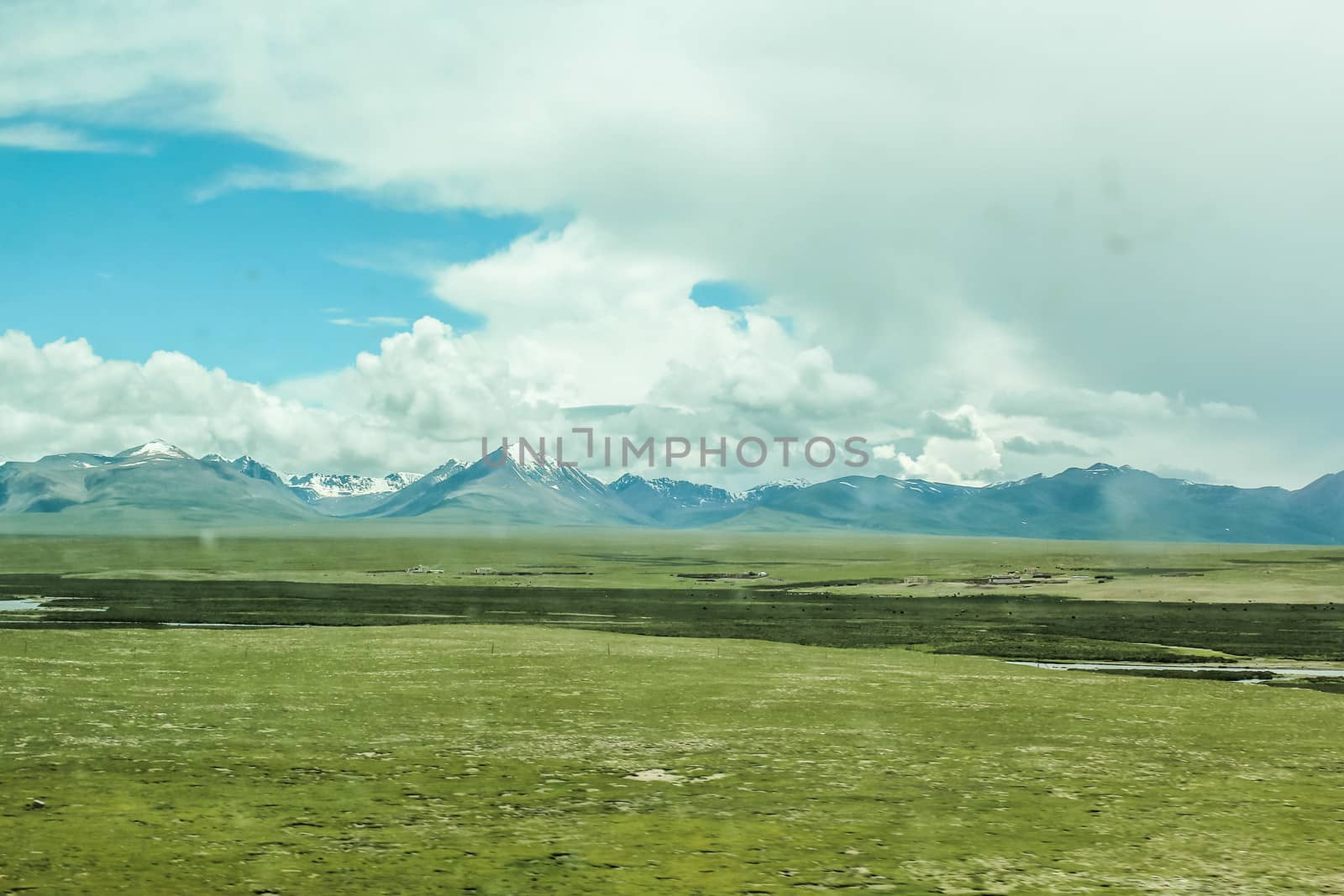 Scenic landscape view of snow mountain ranges and surroundings in Tibet 