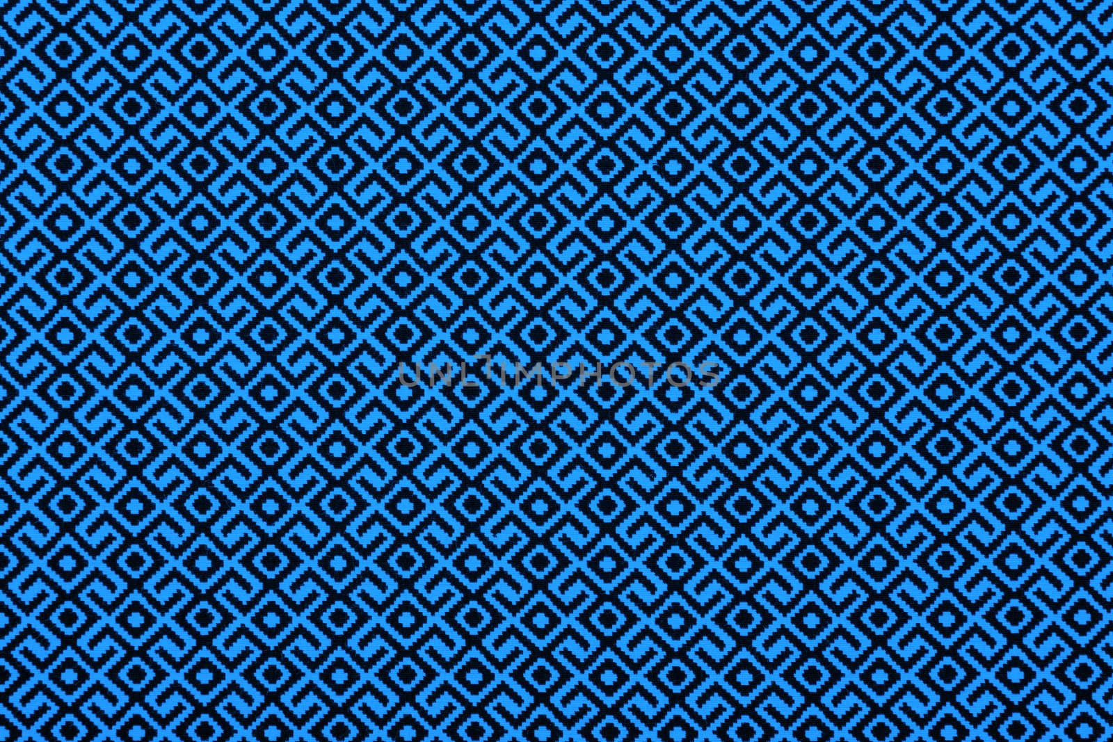 Material in geometric patterns, a textile background.