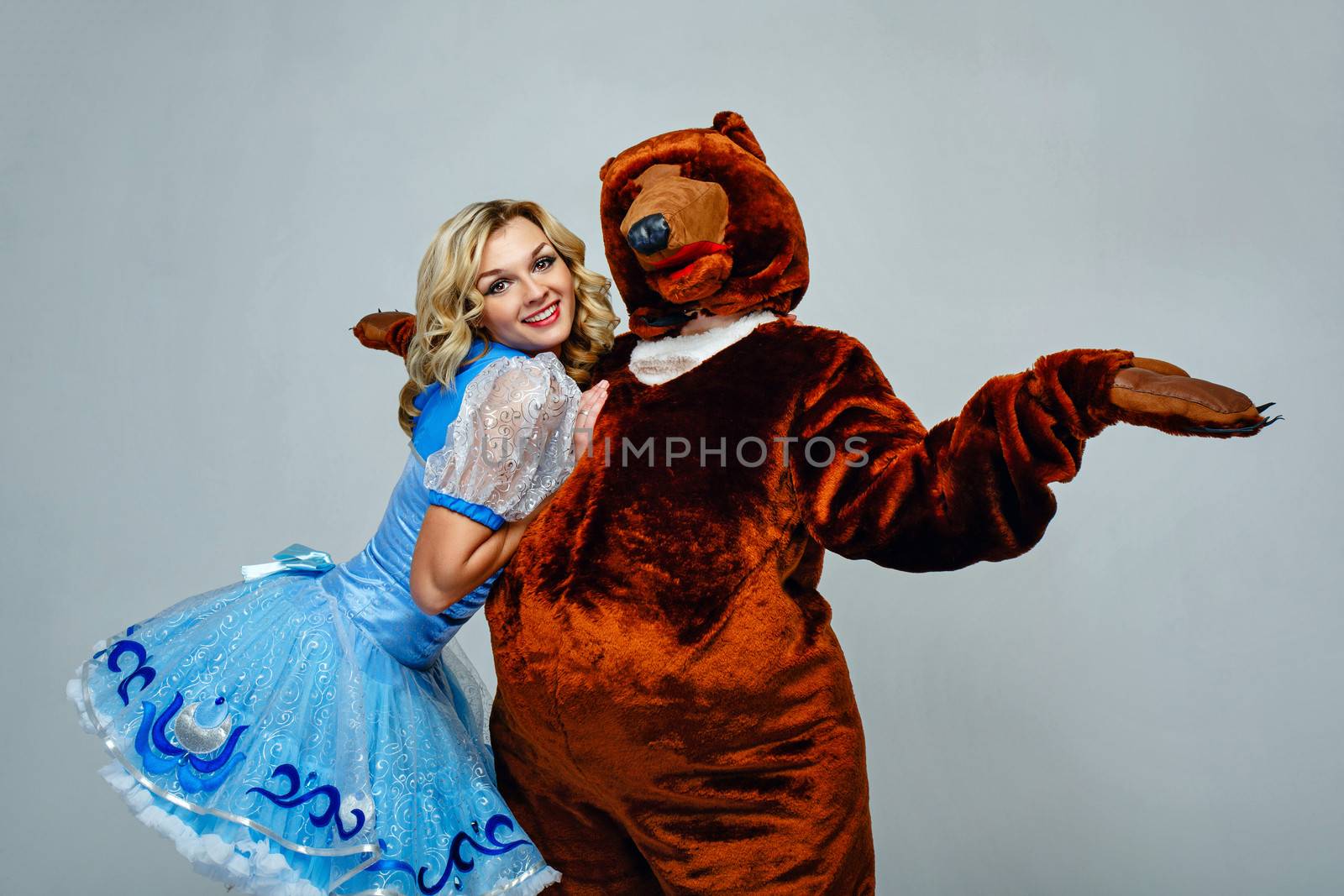 Attractive young girl put her hands on his chest puppets bear