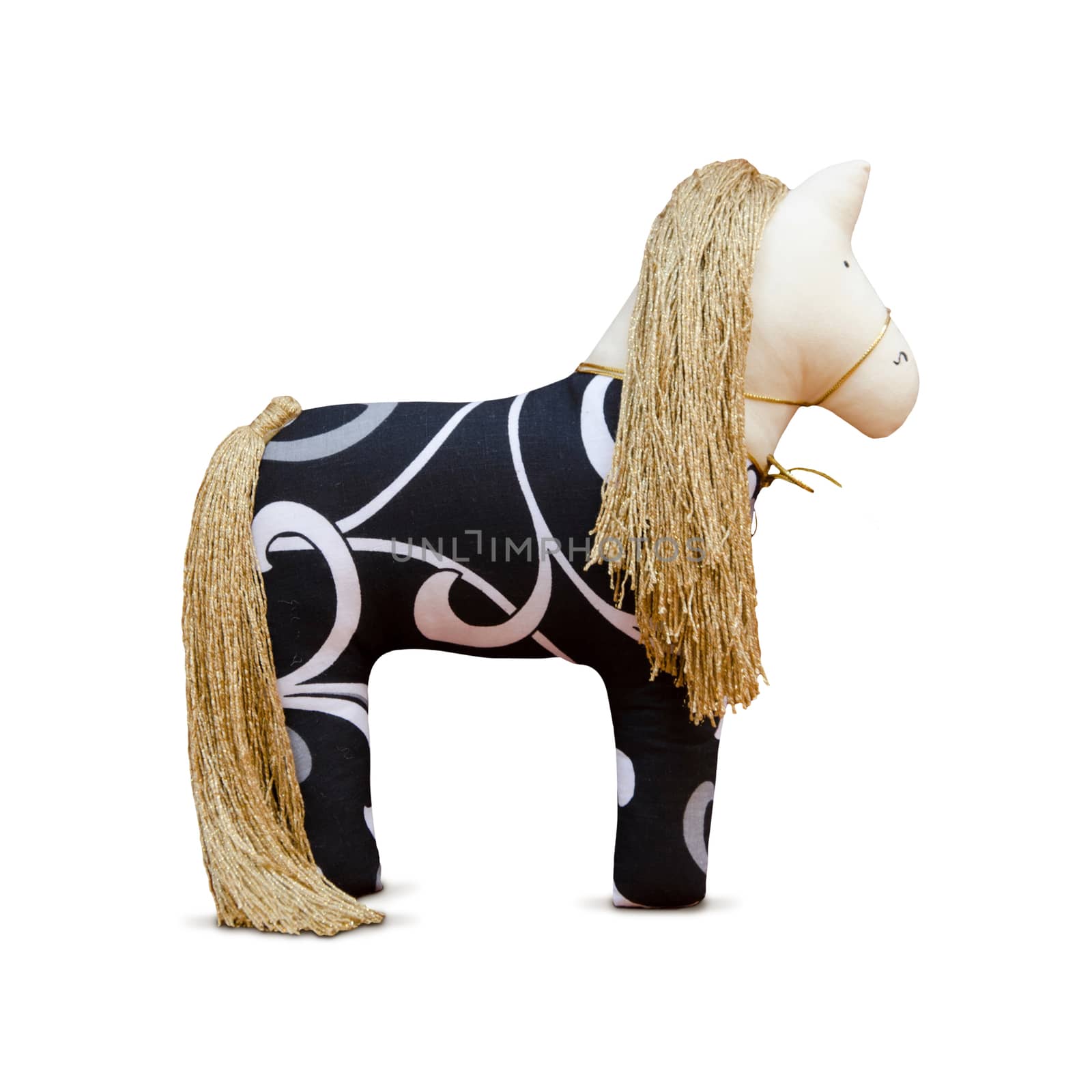 The Hand made soft toy horse isolated with golden mane and bridle