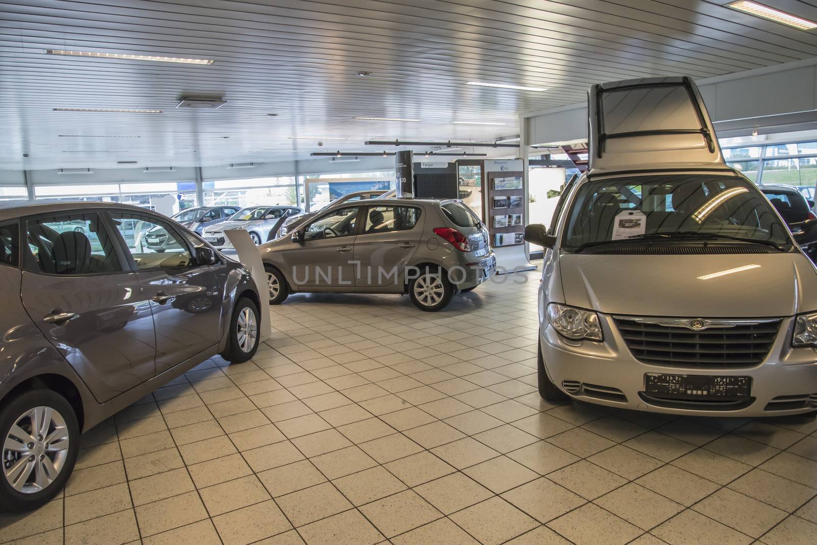 new cars in a car-dealership by steirus