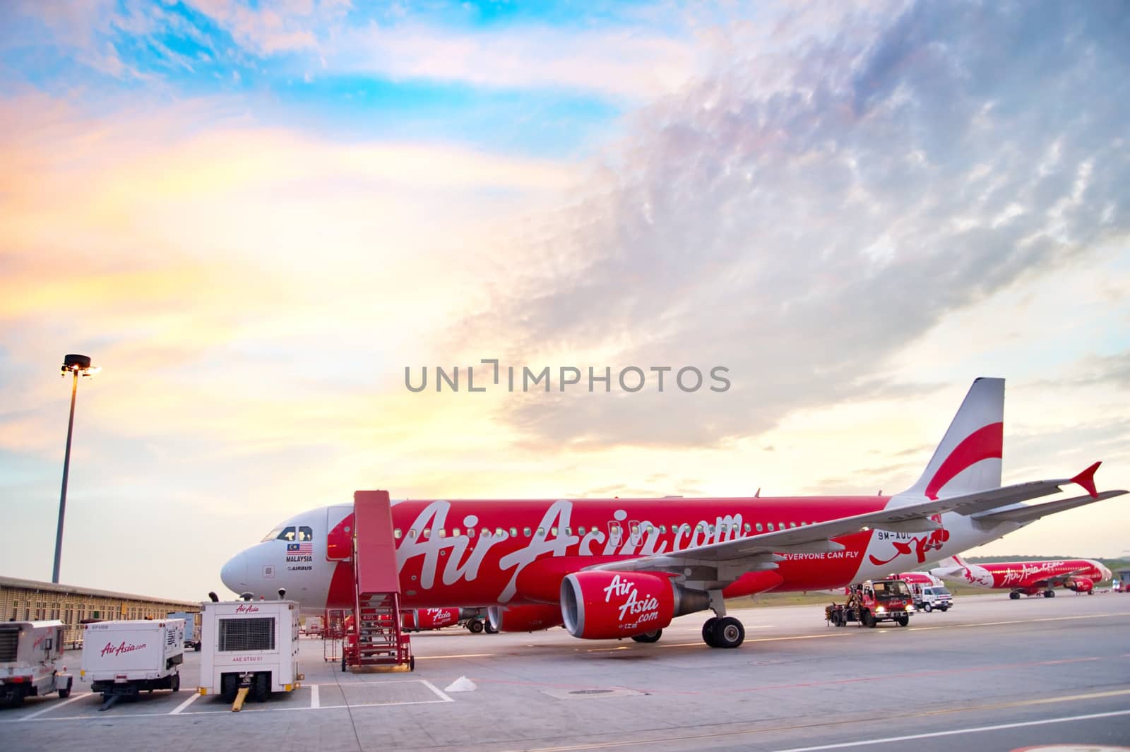 Kuala Lumpur, Malaysia - May 14, 2013: AirAsia Jet airplane in Kuala Lumpur airport in Kuala Lumpur. Its been named as world's best low-cost airline, operates scheduled flights to 78 destinations