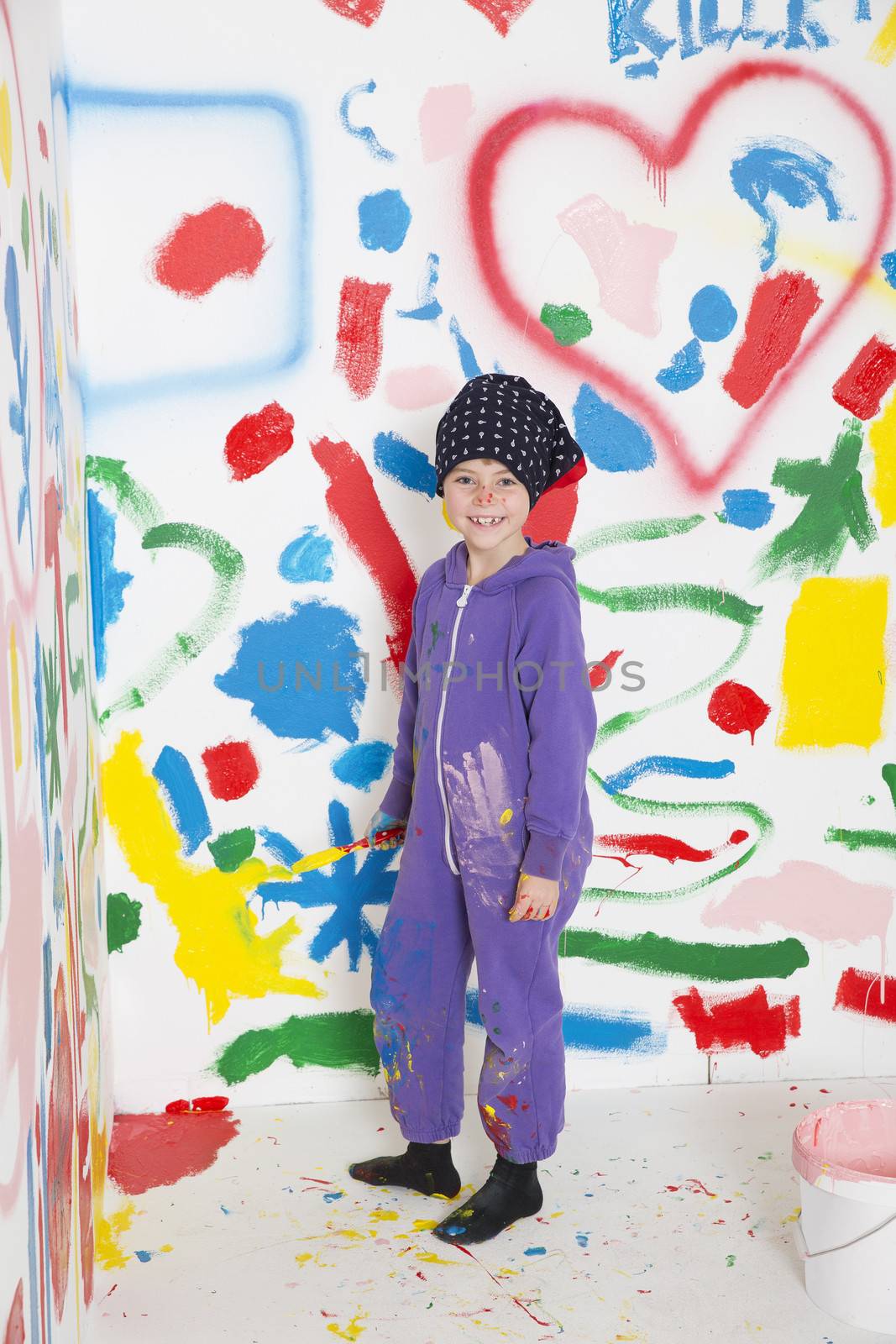 Little Girl painting a room