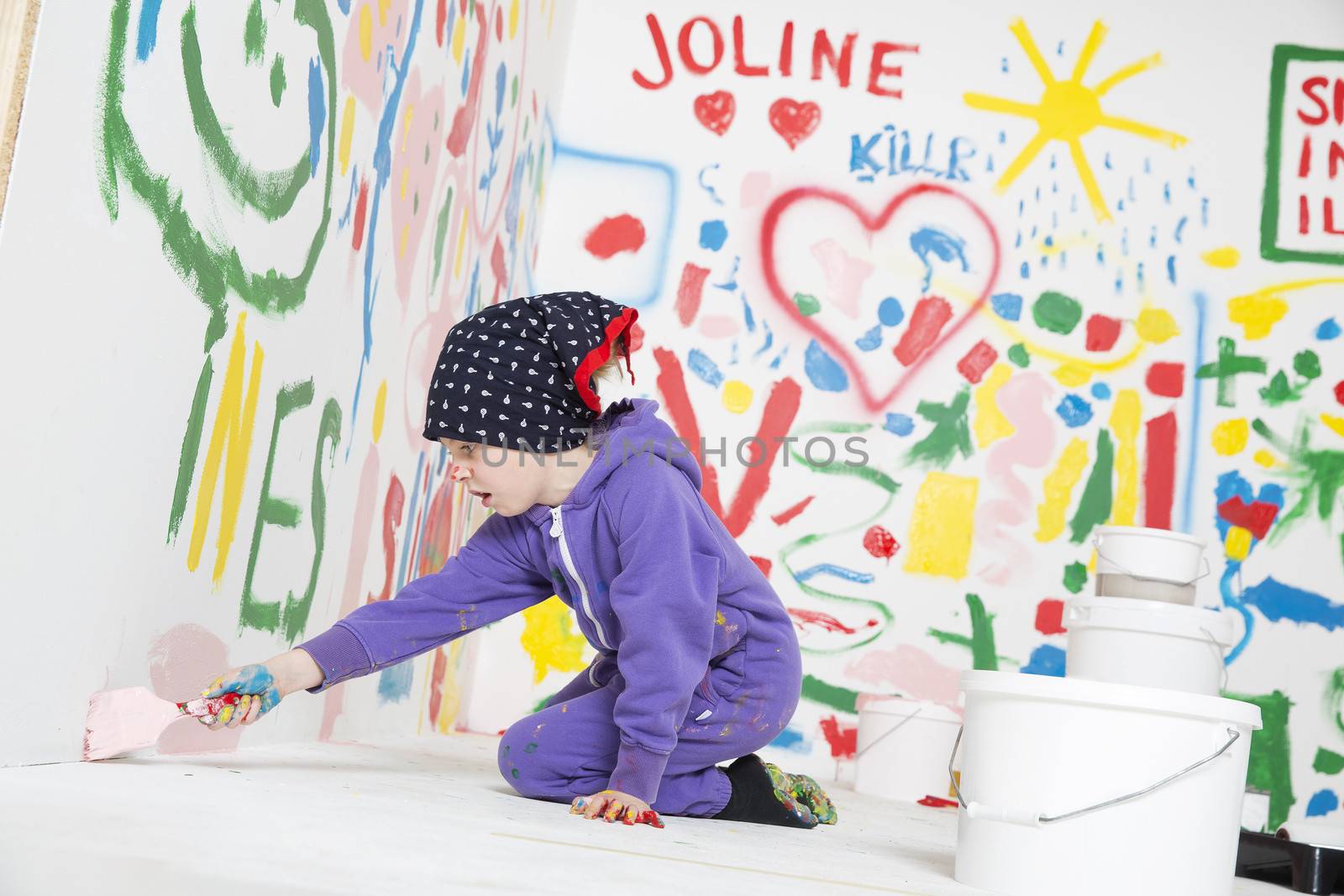 Little Girl painting a room