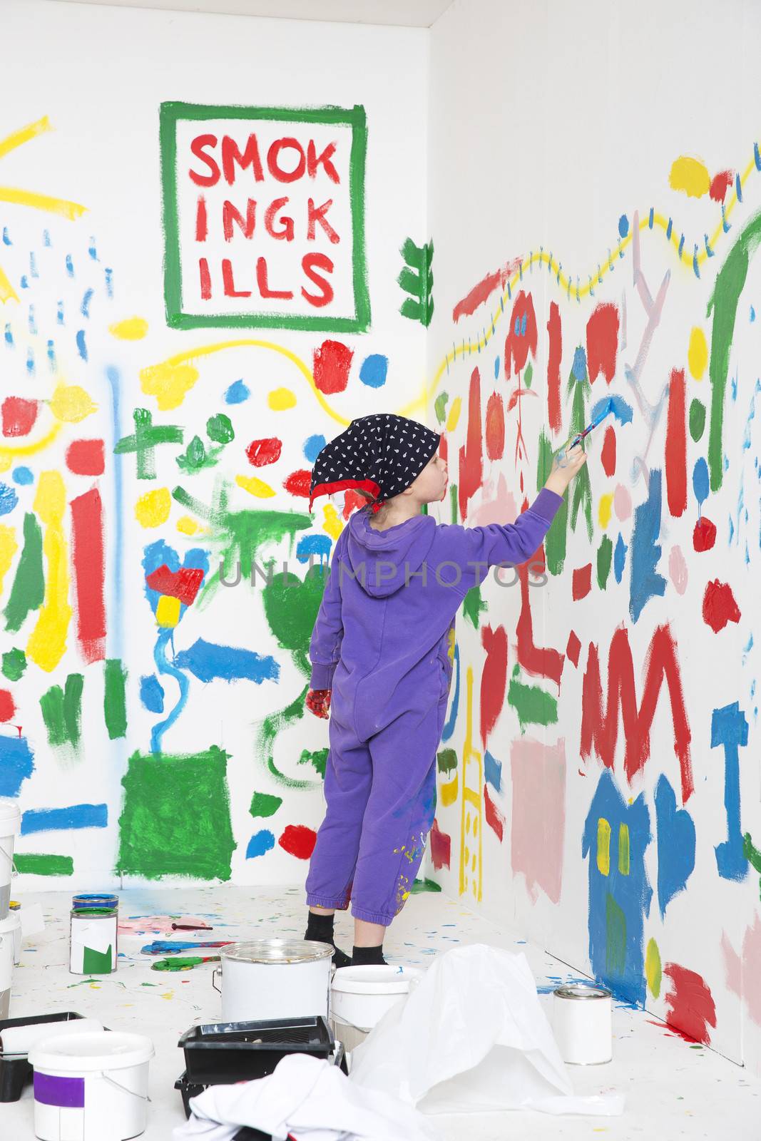Little Girl painting a room