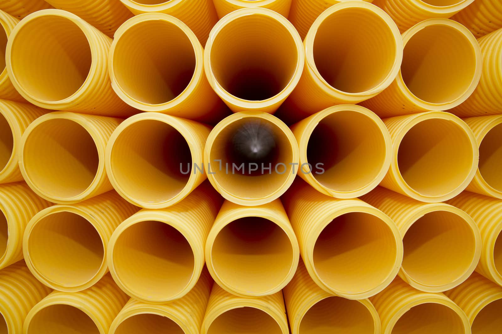 Yellow plastic pipes full frame