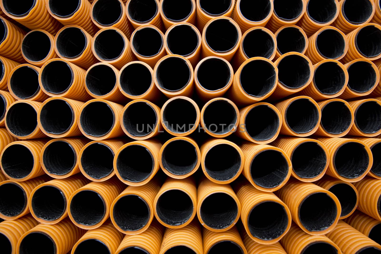 Orange plastic pipes full frame