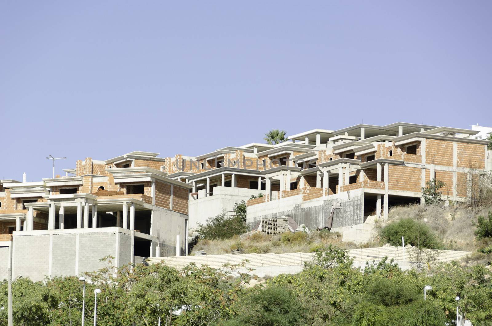 Unfinished buildings in Albufeira Portugal built with brick stones