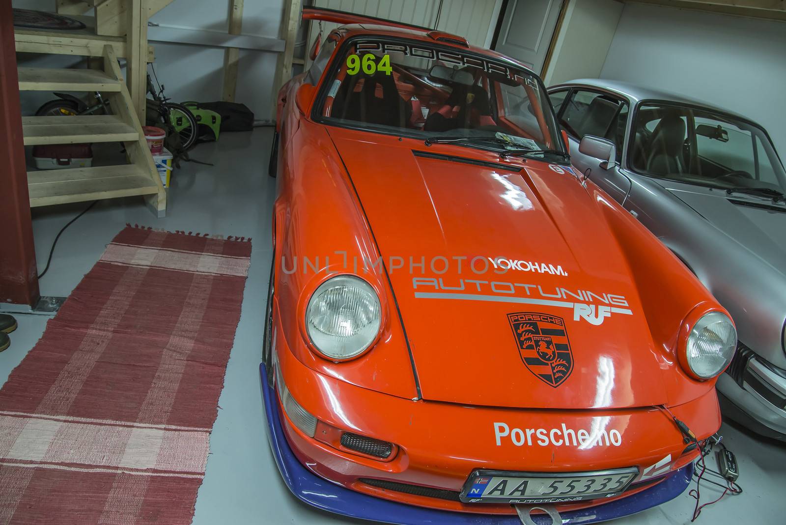 race cars in a garage by steirus