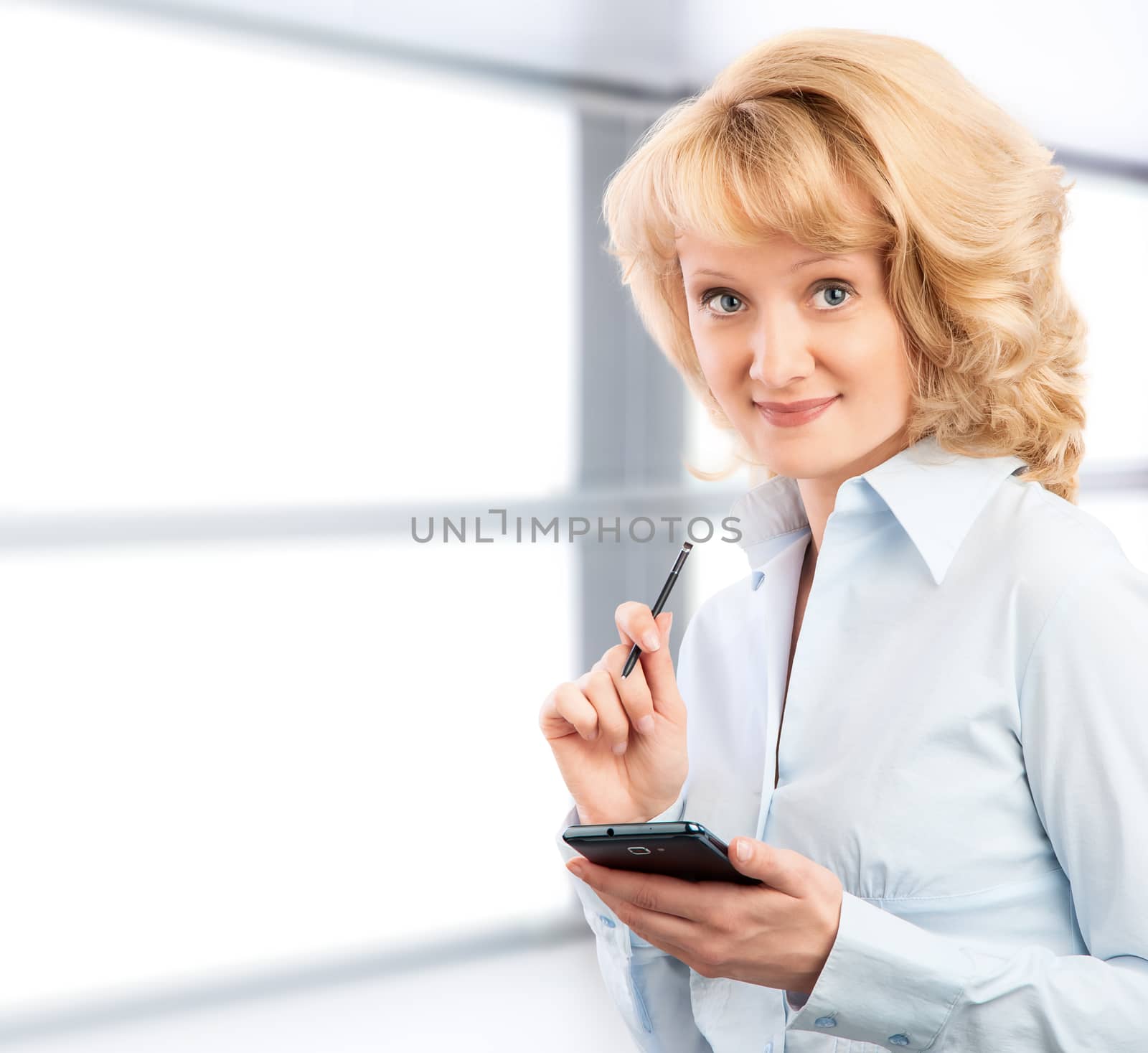 Business woman using her smartphone