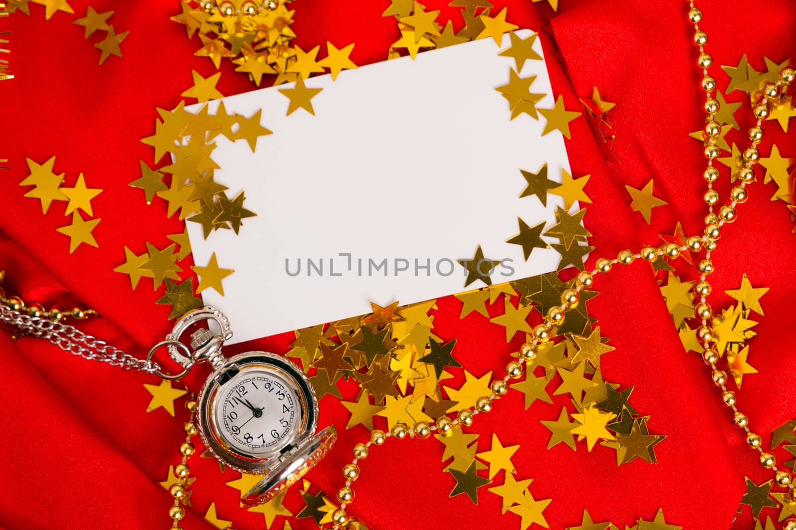 Card on a red background with clock and golden confetti
