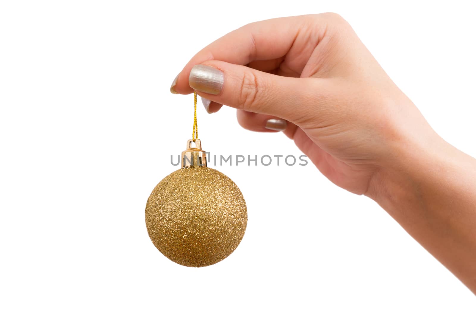 Hand holds a Christmas toy on a white background. isolated.