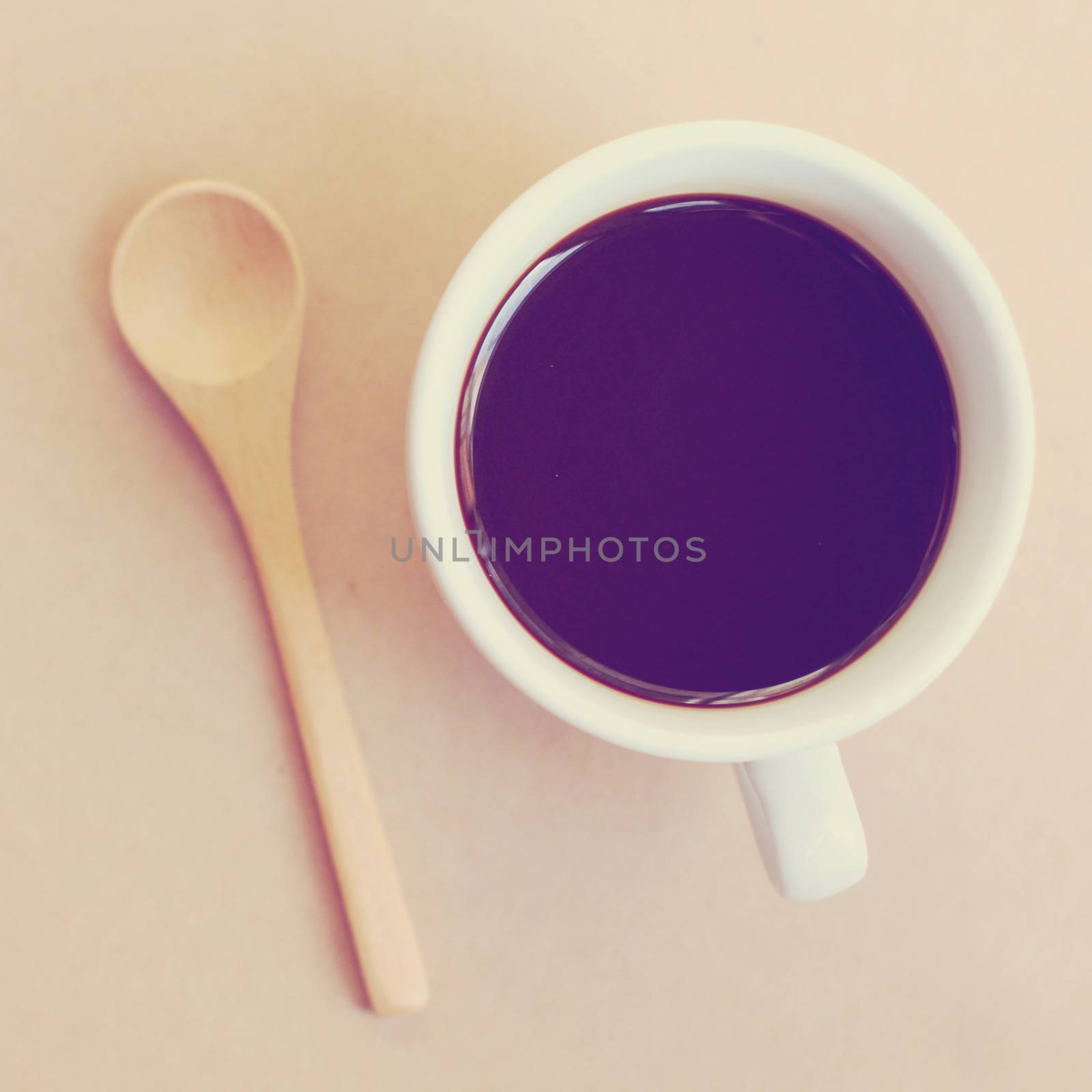 Black coffee and spoon with retro filter effect by nuchylee