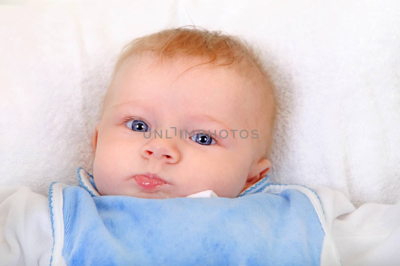 Baby Boy Portrait on the White Blanket Closeup