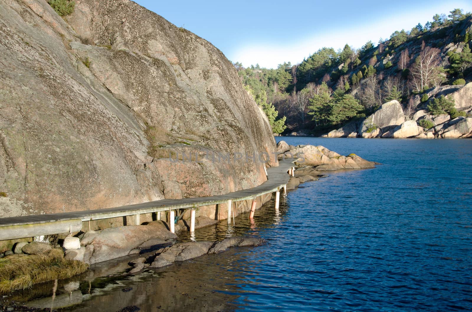 
Boardwalk along the mountain on the bridge towards the water