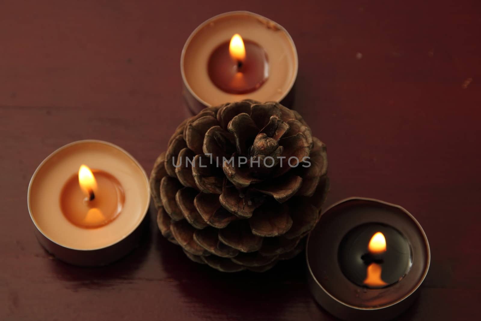 Three candles and bump in brown tones. by Metanna