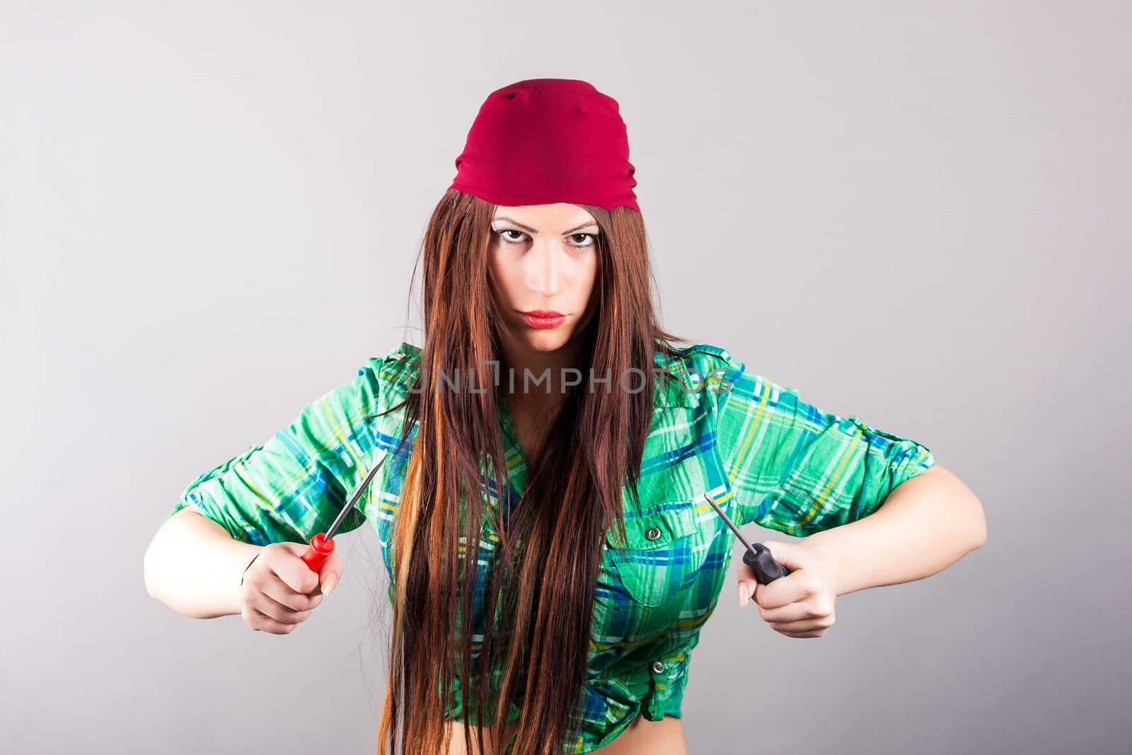 portrait of young woman with screwdrivers