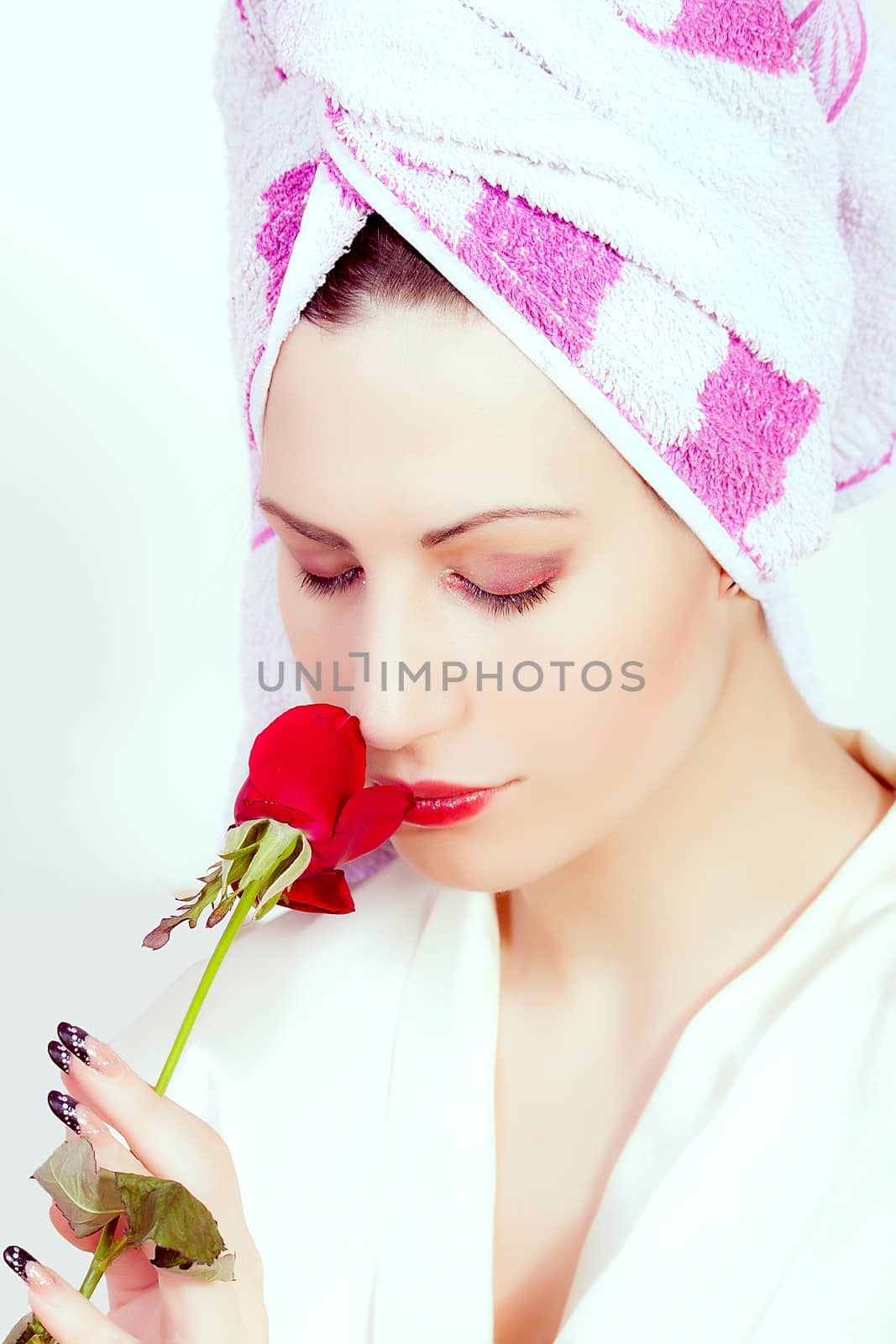 portrait of beautiful young smiling woman with a flower