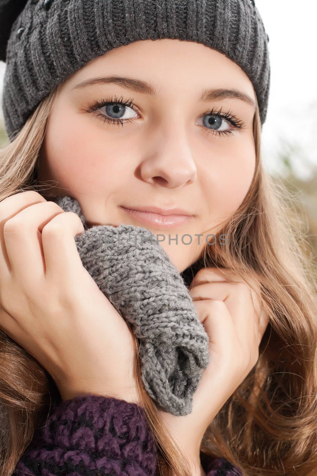 Young teenage girl is having a nice time in the cold november