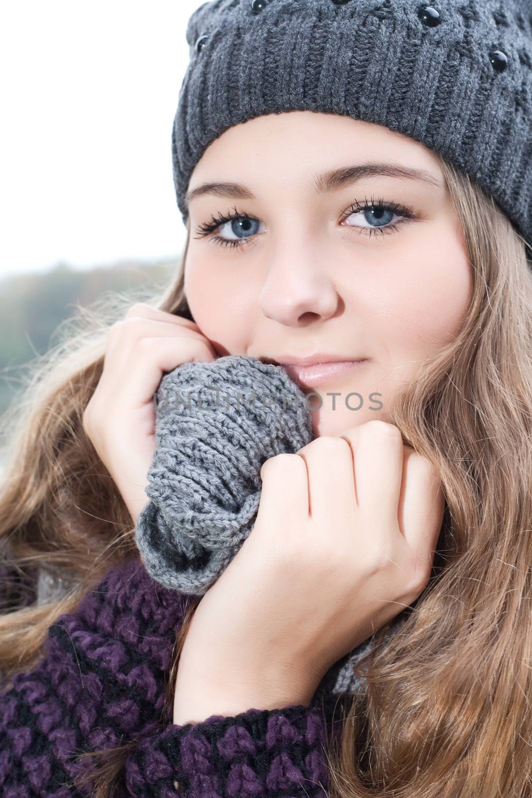 Young teenage girl is having a nice time in the cold november