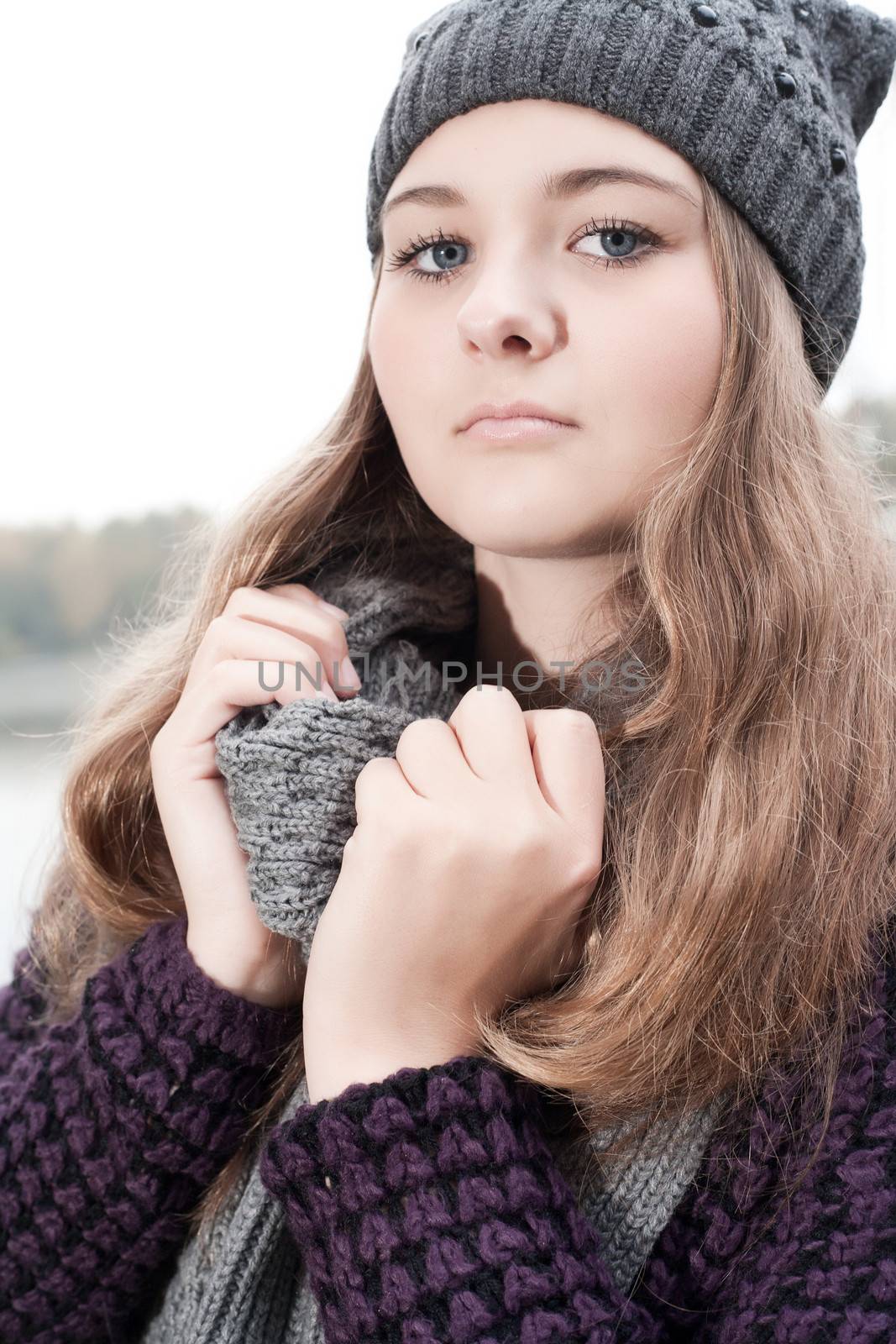 Young teenage girl is having a nice time in the cold november