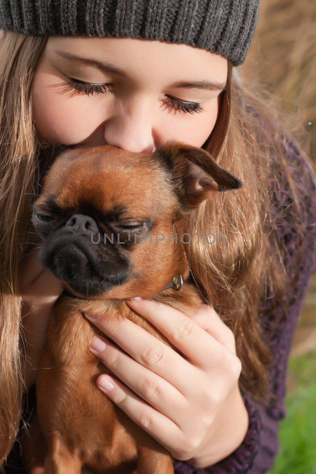 Young teenage girl is having a nice time in the cold november