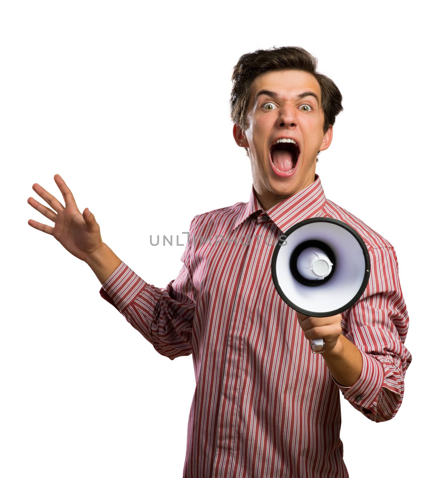 Portrait of a young man shouting using megaphone, isolated on white