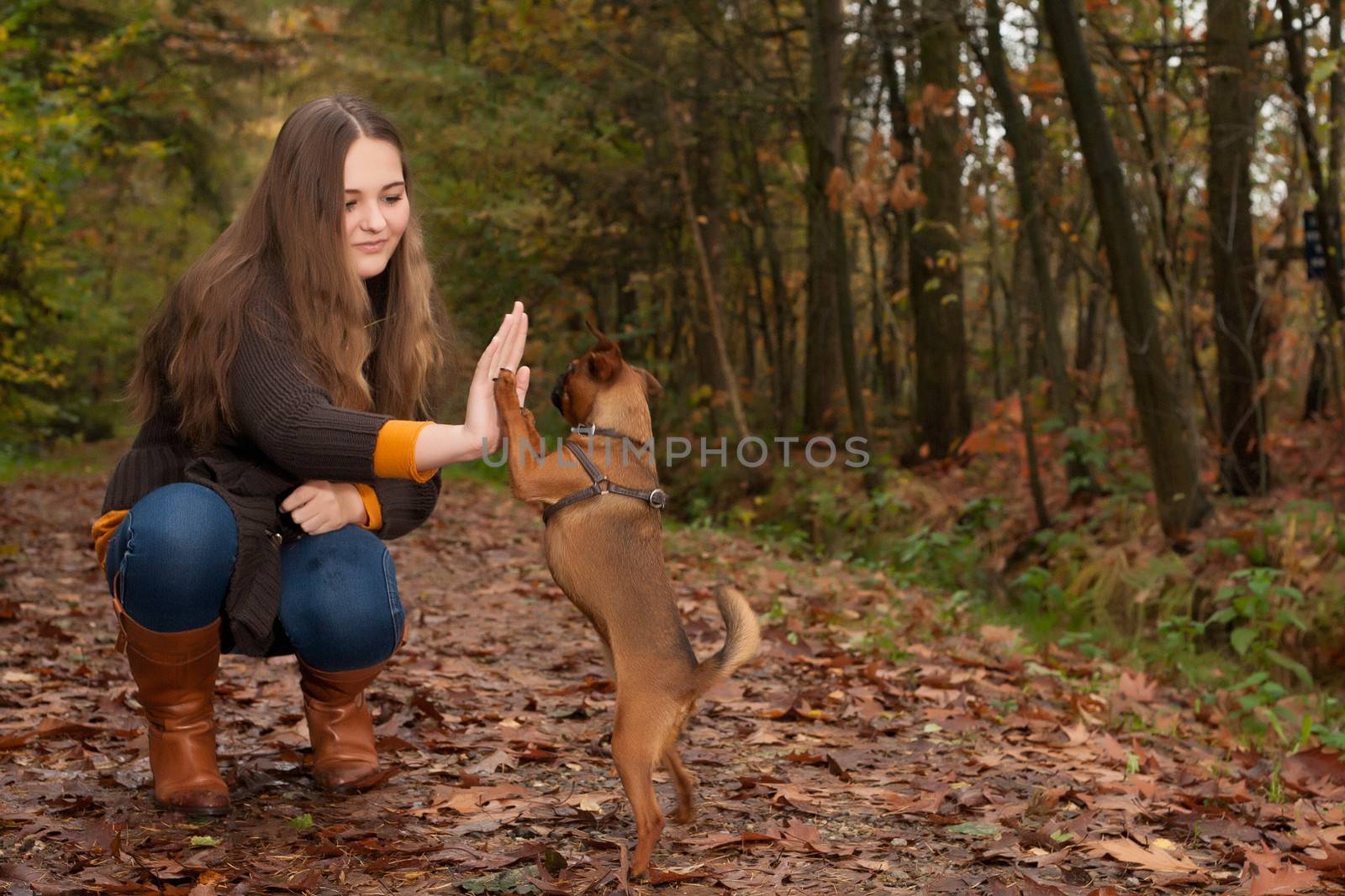 Young teenage girl is having a nice time in the cold november