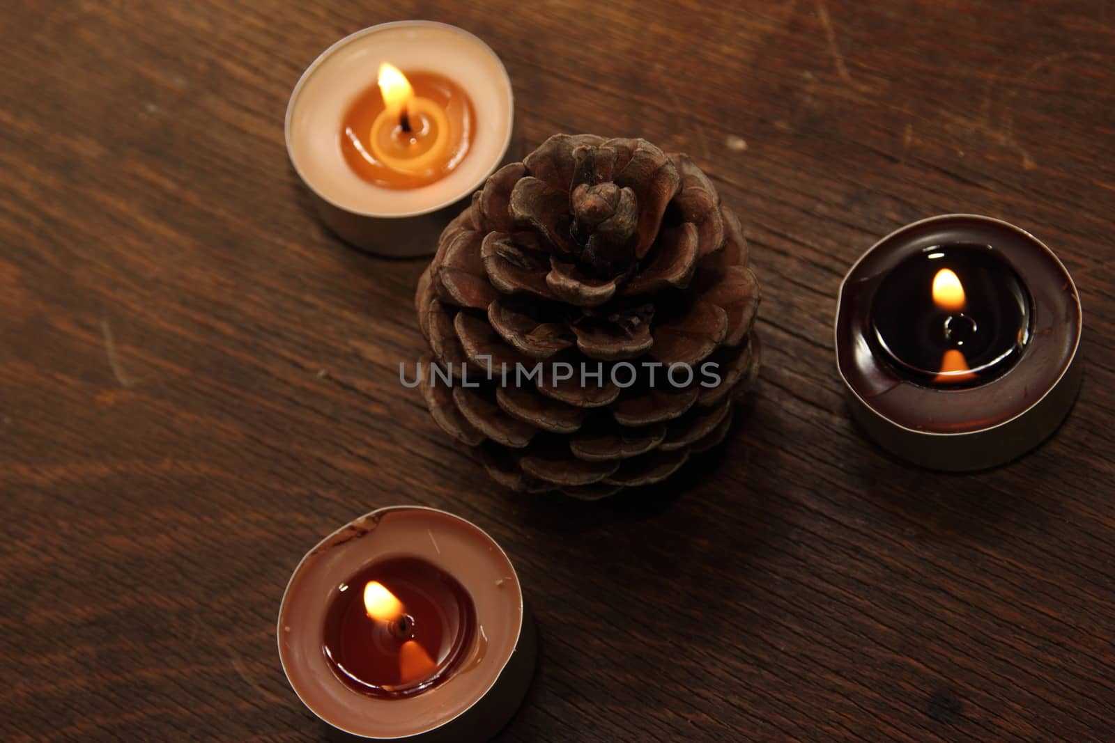 Three candles and bump in brown tones. by Metanna