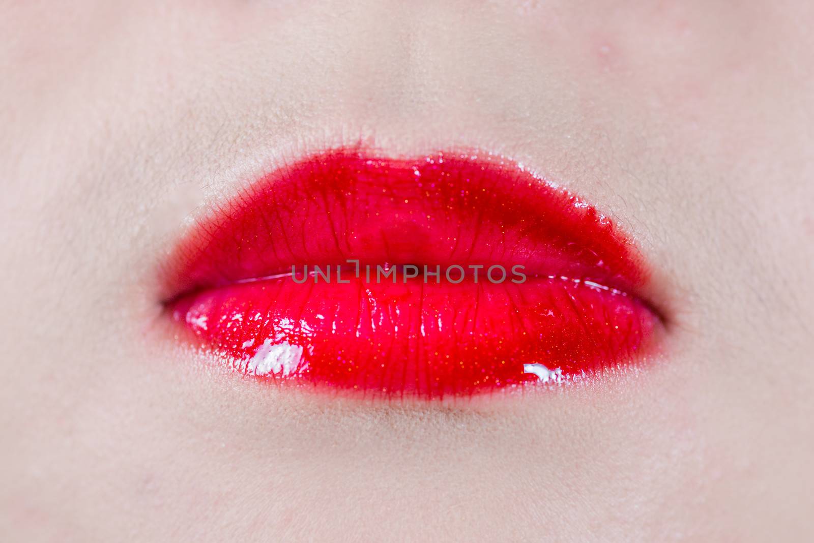 Close up of woman lips with colored lipsticks