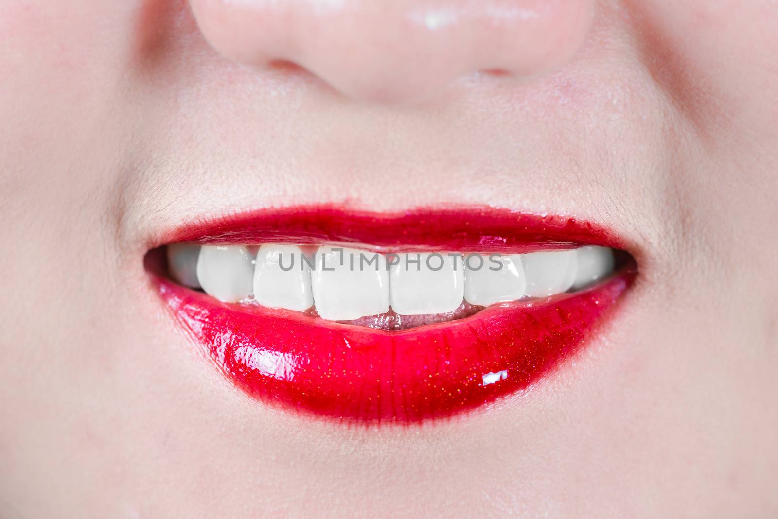 Closeup of woman's lips with makeup smiling