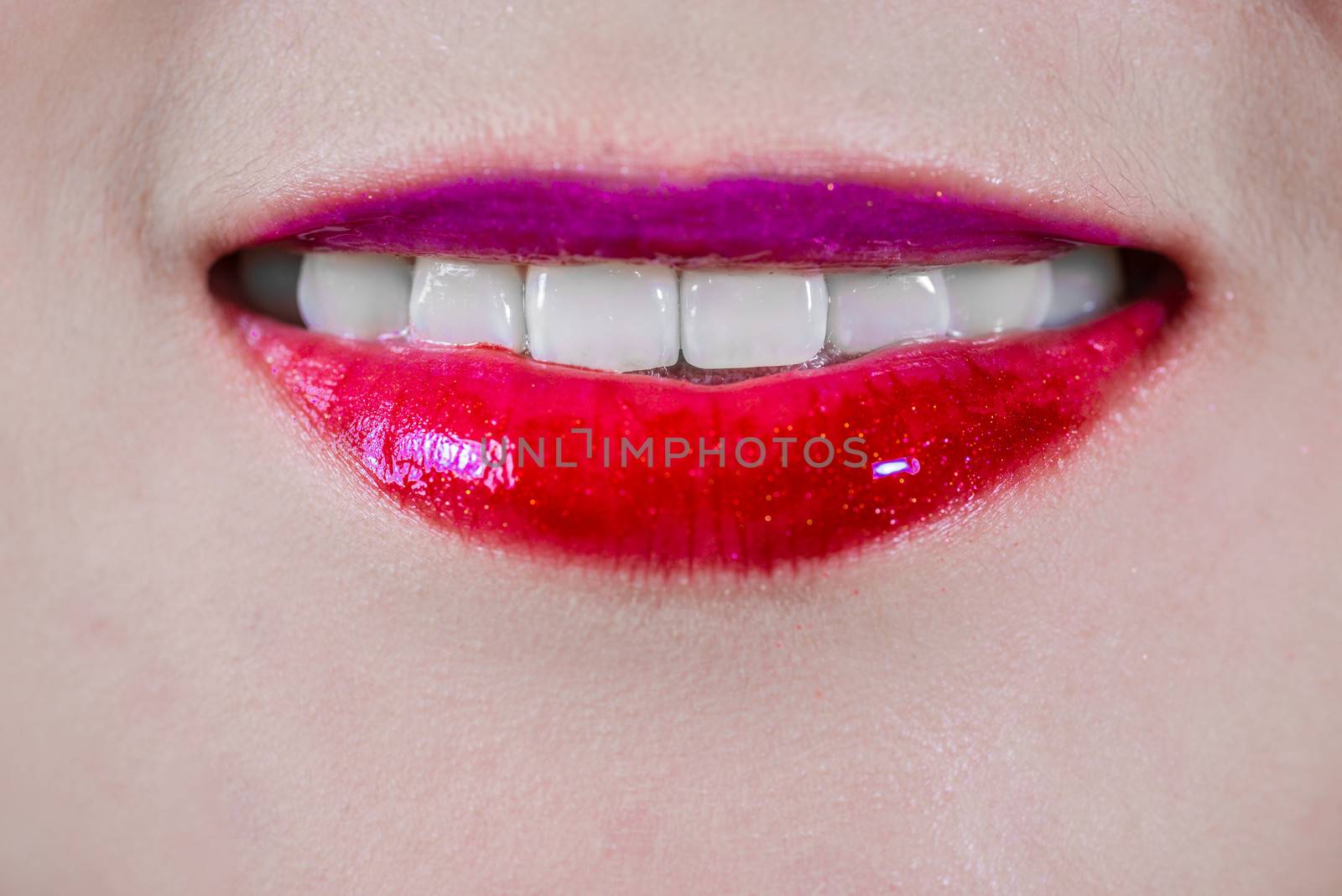 Closeup of woman's lips with makeup smiling