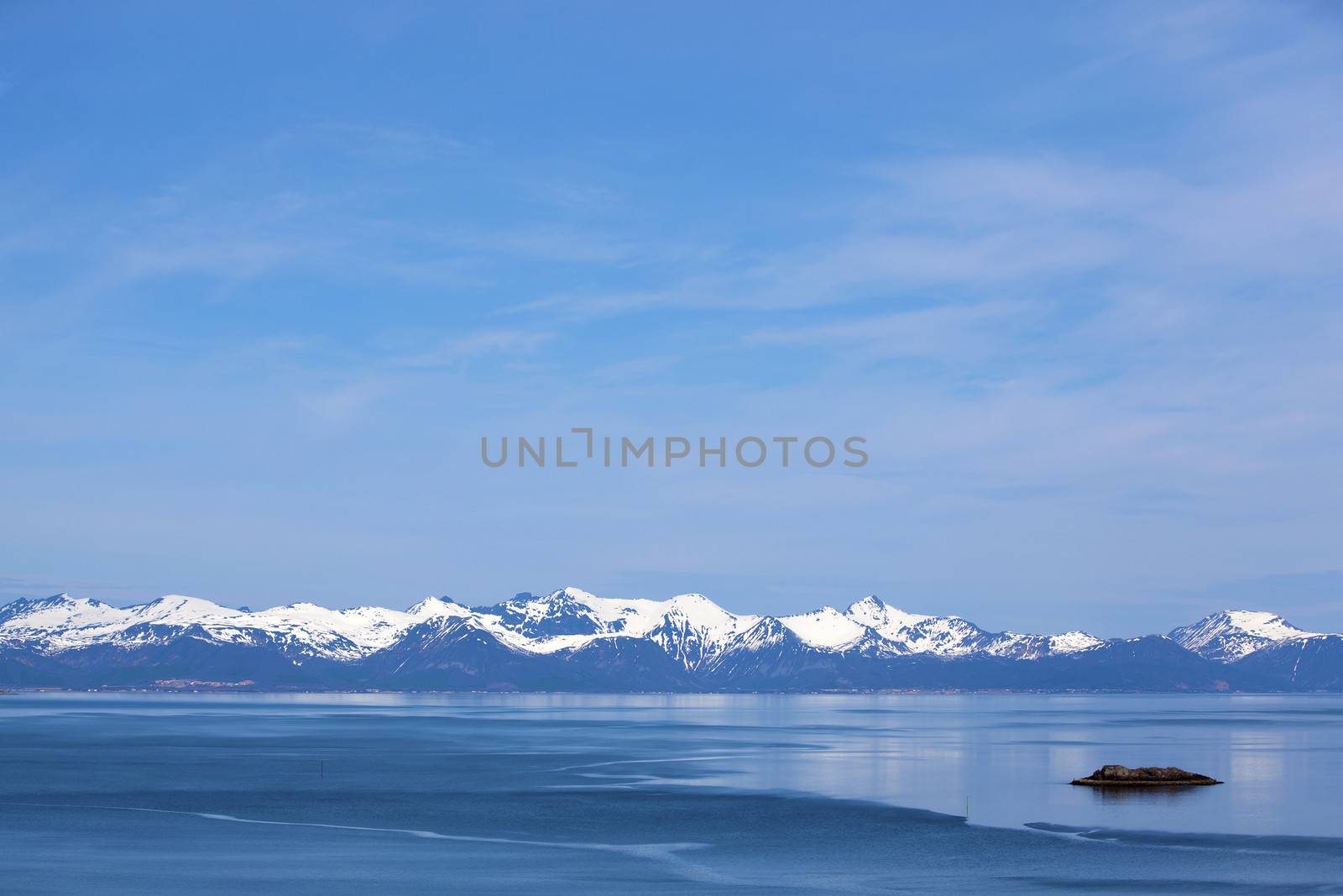 Snowcapped mountains and blue water, Norwegian fjord