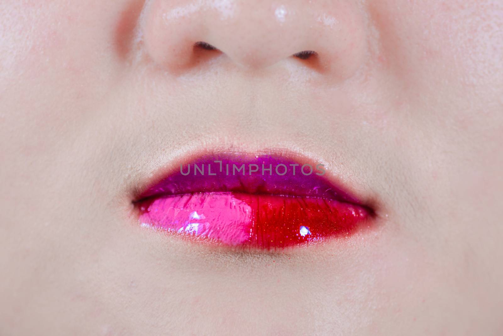 Closeup of woman's lips with makeup with a weird smirk