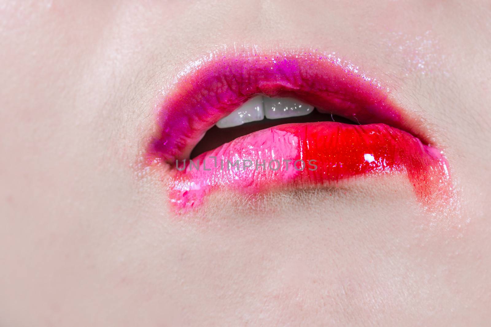 Lips with smeared lipsticks by IVYPHOTOS