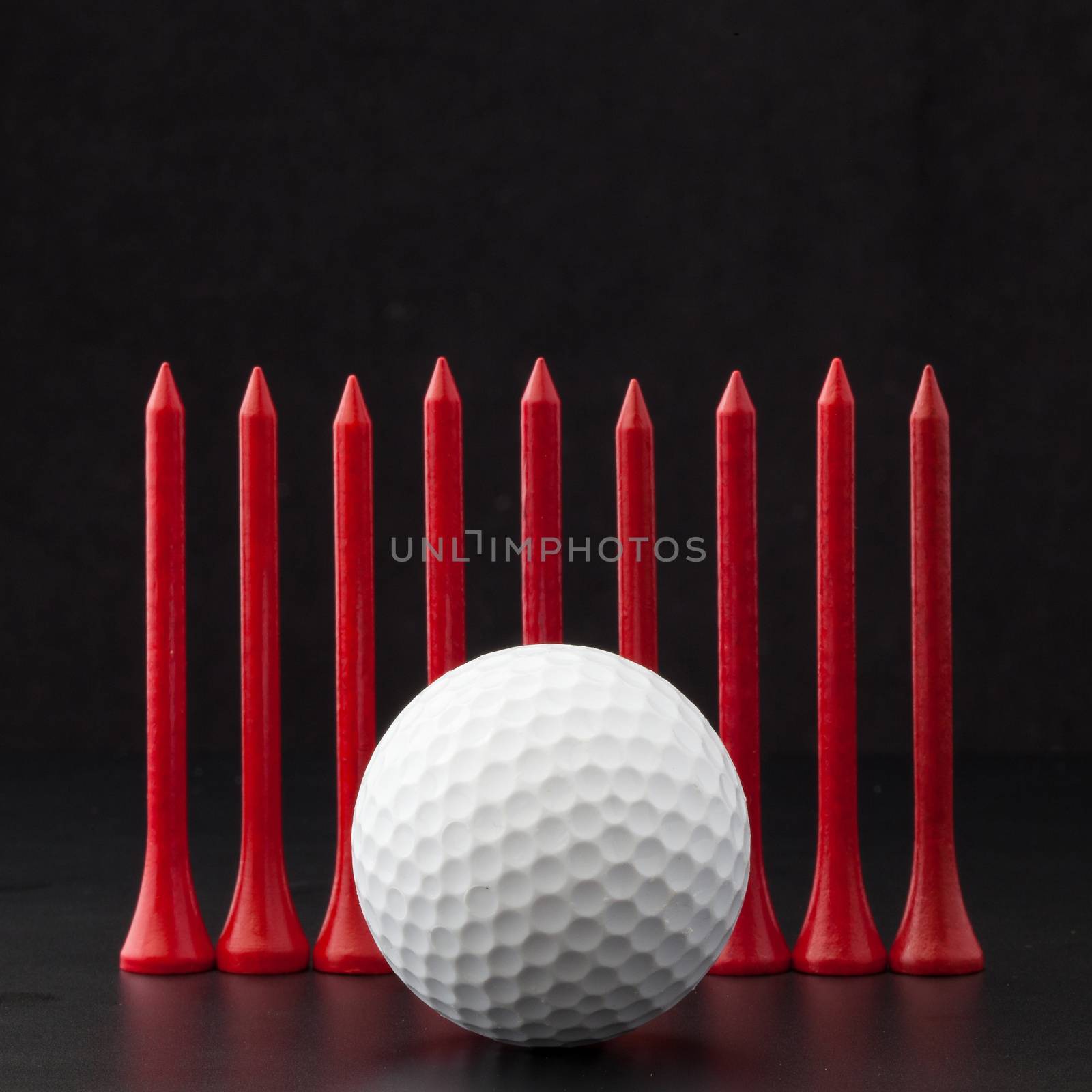 Golf balls on the black background by CaptureLight