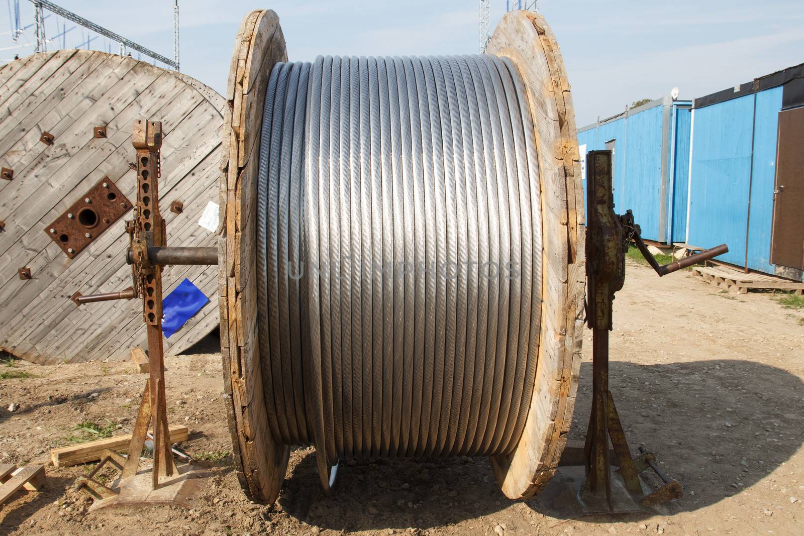 large wooden bobbin with electrical wire