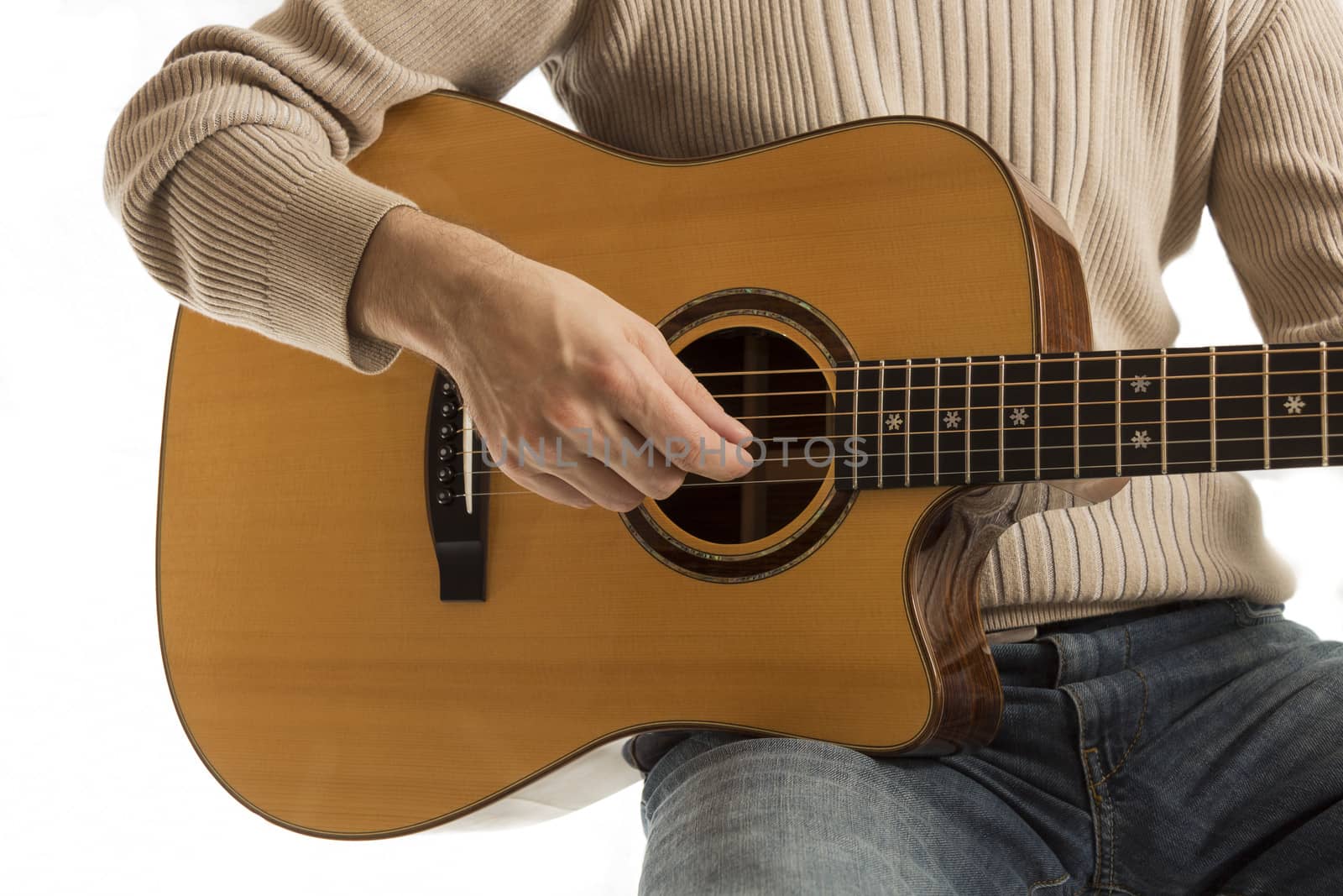 Musician playing an acoustic guitar by snowwhite