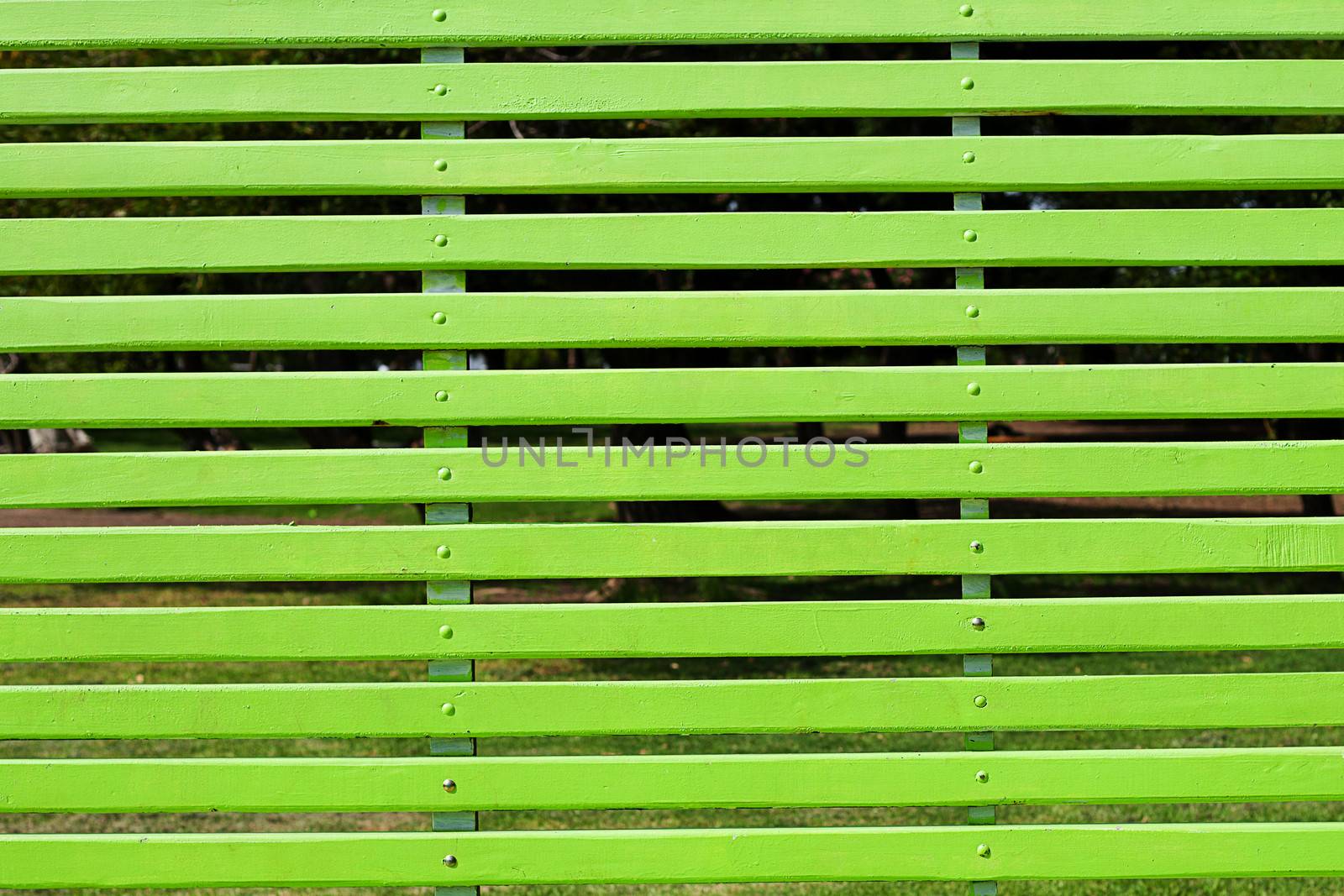 gigantic green bench in the park by jannyjus