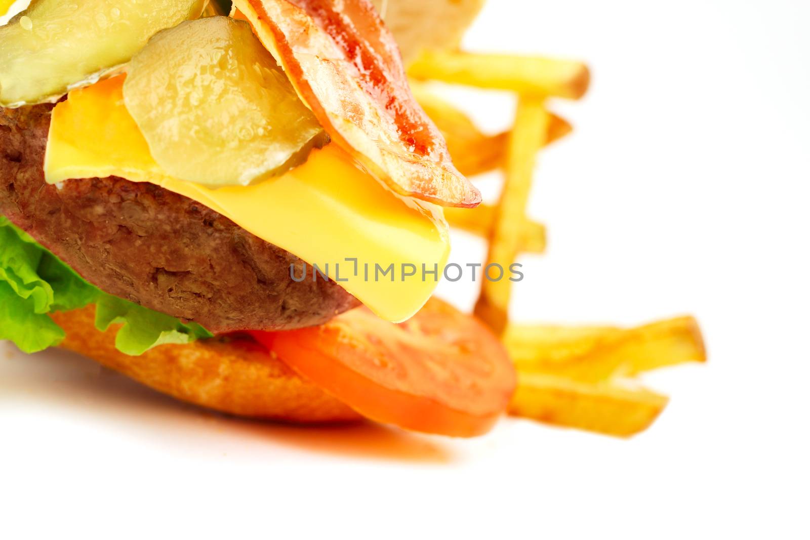 Exploded view of hamburger with french fries isolated on white background